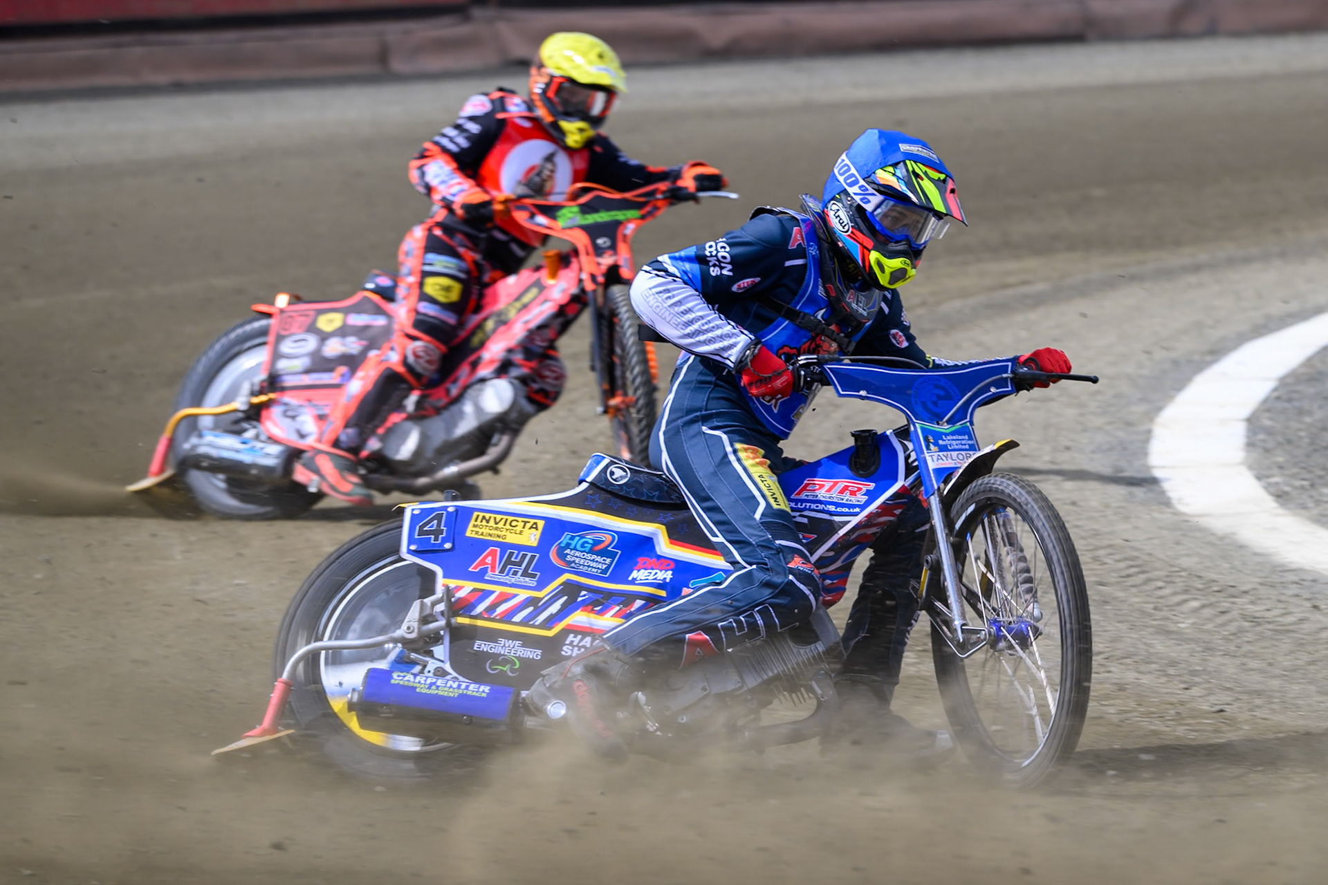 Jamie Etherington of Buxton Bulls  in Blue leading Alex Spooner of NDL Nomads   in Yellow during the  Challenge match between Buxton Bulls and NDL Nomads at Hi-Edge Speedway, Buxton on Sunday 19th April 2026. (Photo: Ian Charles | MI News)