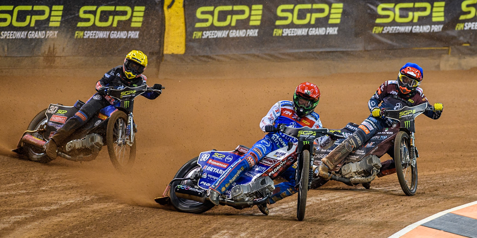 Daniel Bewley (99) of Great Britain in Red leading Dominik Kubera (415) of Poland in Blue and Leon Madsen (30) of Denmark in Yellow during the FIM Speedway Grand Prix of Great Britain at The Principality Stadium, Cardiff on Saturday 17th August 2024. (Photo: Ian Charles | MI News)