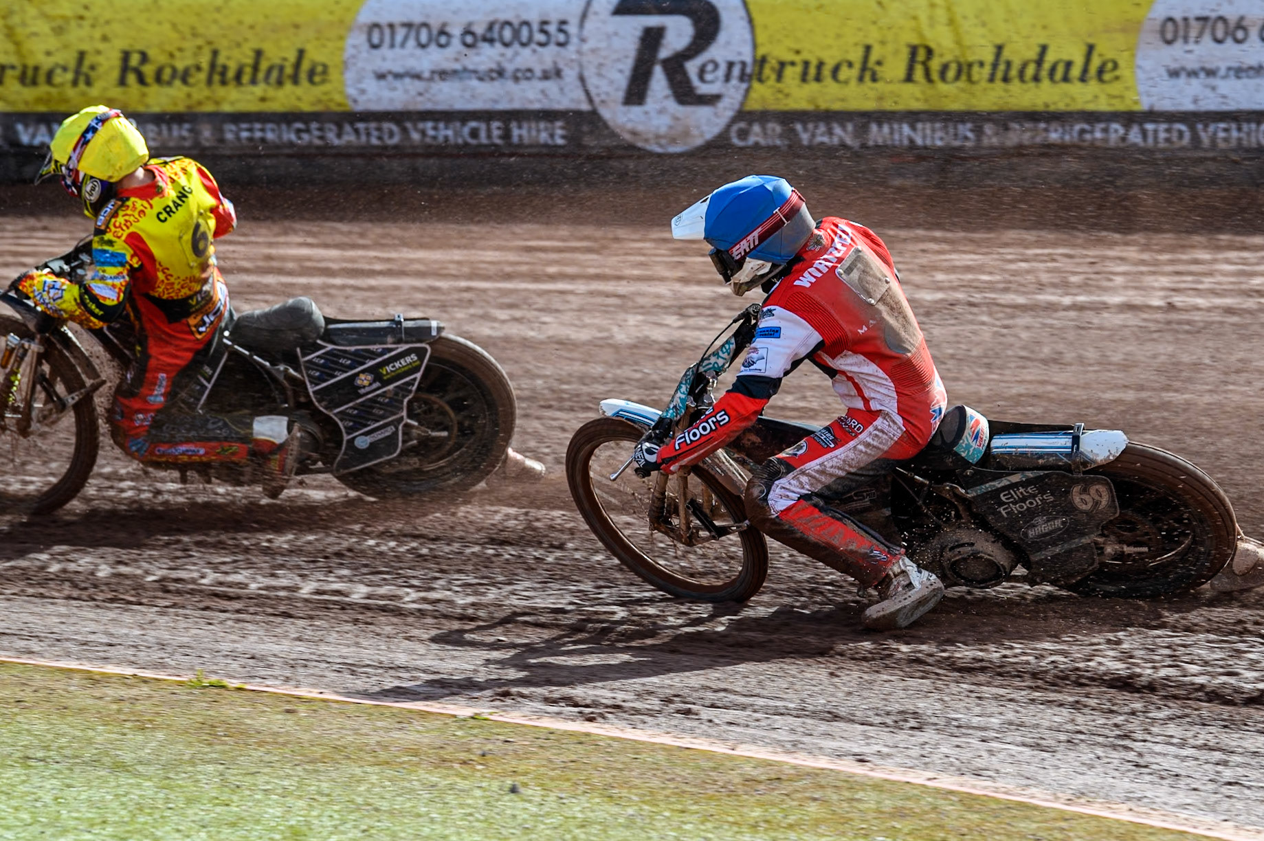 Belle Vue Colts' Chad Wirtzfeld (Blue) chases Leicester Lion Cubs' Luke Crang (Yellow) during the WSRA National Development League match between Belle Vue Colts and Leicester Lion Cubs at the National Speedway Stadium, Manchester on Friday 29th March 2024. (Photo: Ian Charles | MI News)