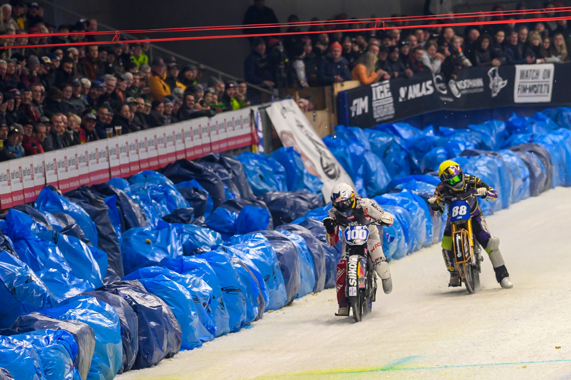 Franz Zorn (100) of Austria in White beats Max Niedermaier (88) of Germany in Yellow over the finish line during the Ice Speedway Gladiators World Championship Final 2 at Max-Aicher-Arena, Inzell on Sunday 15th March 2026. (Photo: Ian Charles | MI News)