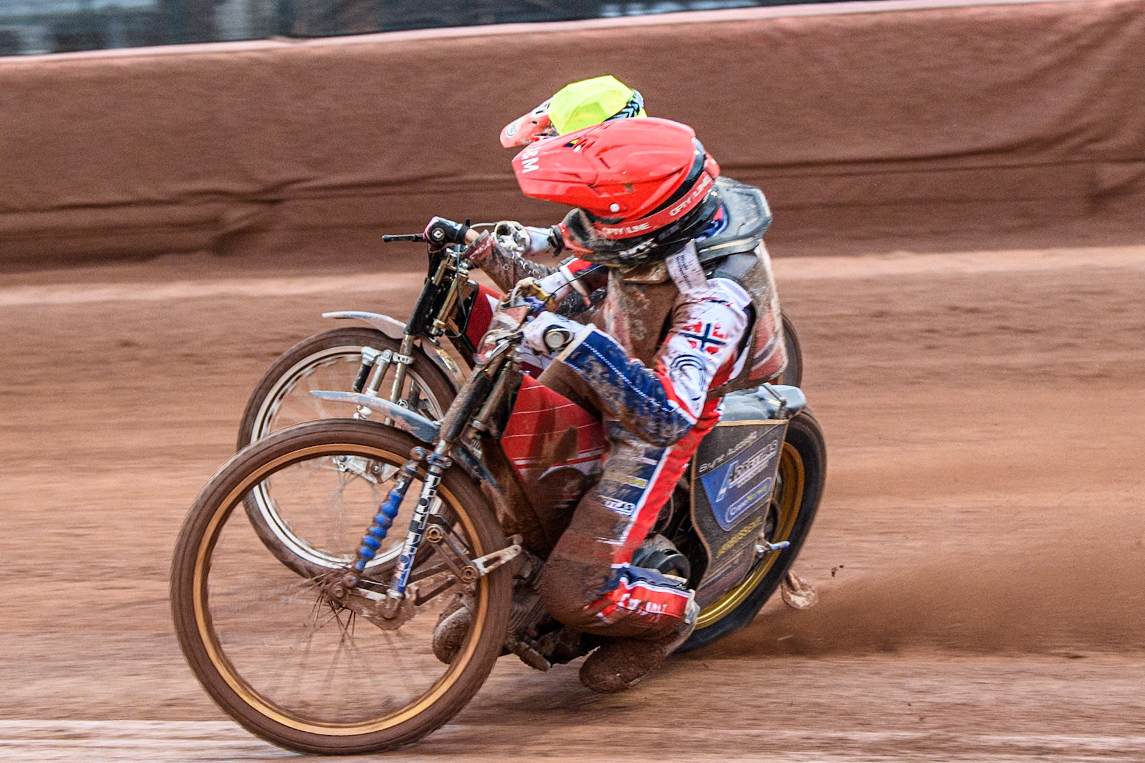 Mathias Pollestad of Norway in Red rides inside Daniils Kolodinskis of Latvia in Yellow during the Monster Energy FIM Speedway of Nation Semi Final 2 at the National Speedway Stadium, Manchester on Wednesday 10th July 2024. (Photo: Ian Charles | MI News)