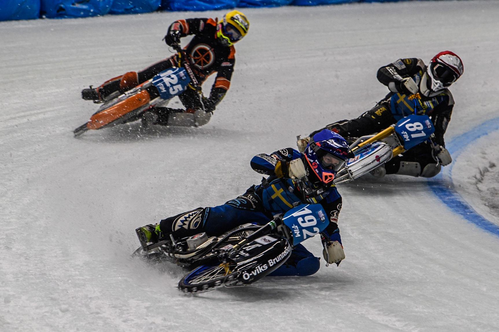 Niclas Svensson (192) of Sweden in Blue leading Jimmy Olsén (81) of Sweden in Red and Sebastian Reitsma (125) of The Netherlands in Yellow during the Ice Speedway Gladiators World Championship Final 1 at Max-Aicher-Arena, Inzell on Saturday 15th March 2025. (Photo: Ian Charles | MI News)