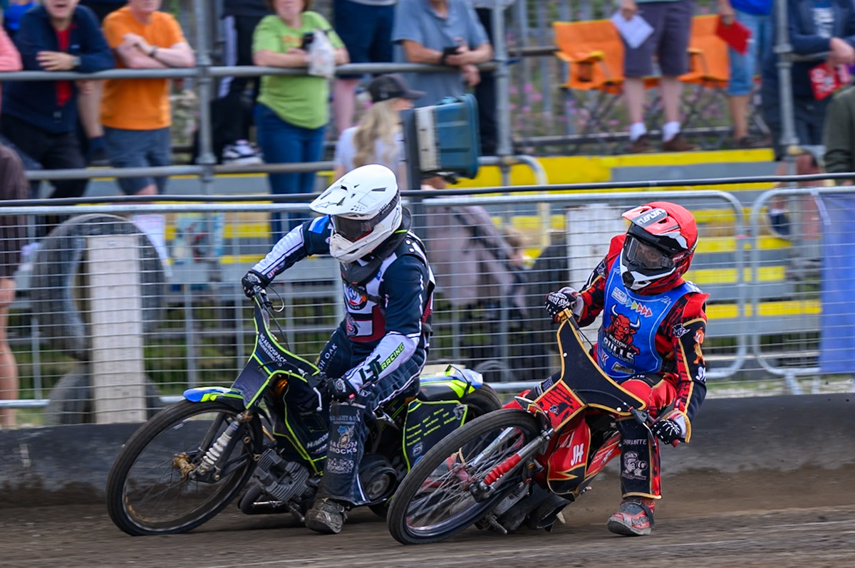 Nathan Ablitt of Middlesborough Tigers in White forces his way past Luke Harris of Buxton Bulls in Red during the WSRA National Development League match  between Buxton Bulls and Middlesborough Tigers at Hi-Edge Speedway, Buxton on Sunday 16th August 2026. (Photo: Ian Charles | MI News)