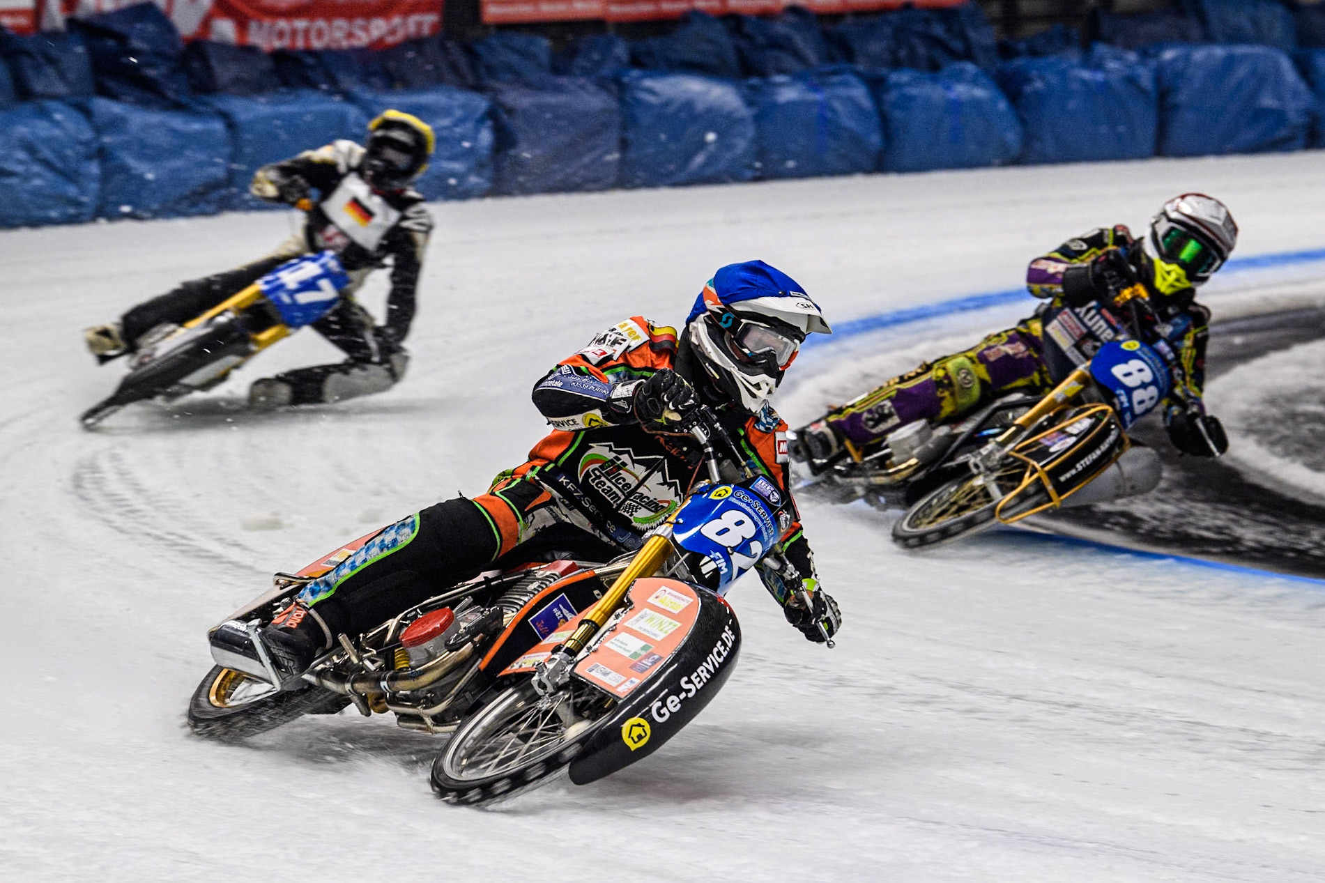 Germany's Markus Jell (82) (Blue) Germany's Max Niedermaier (88) (Red) and Germany's Franz Mayerbüchler (17) (Yellow)  during the FIM Ice Speedway Gladiators World Championship Final 1 at the Max-Aicher-Arena, Inzell on Saturday 23 March 2024. (Photo: Ian Charles | MI News)