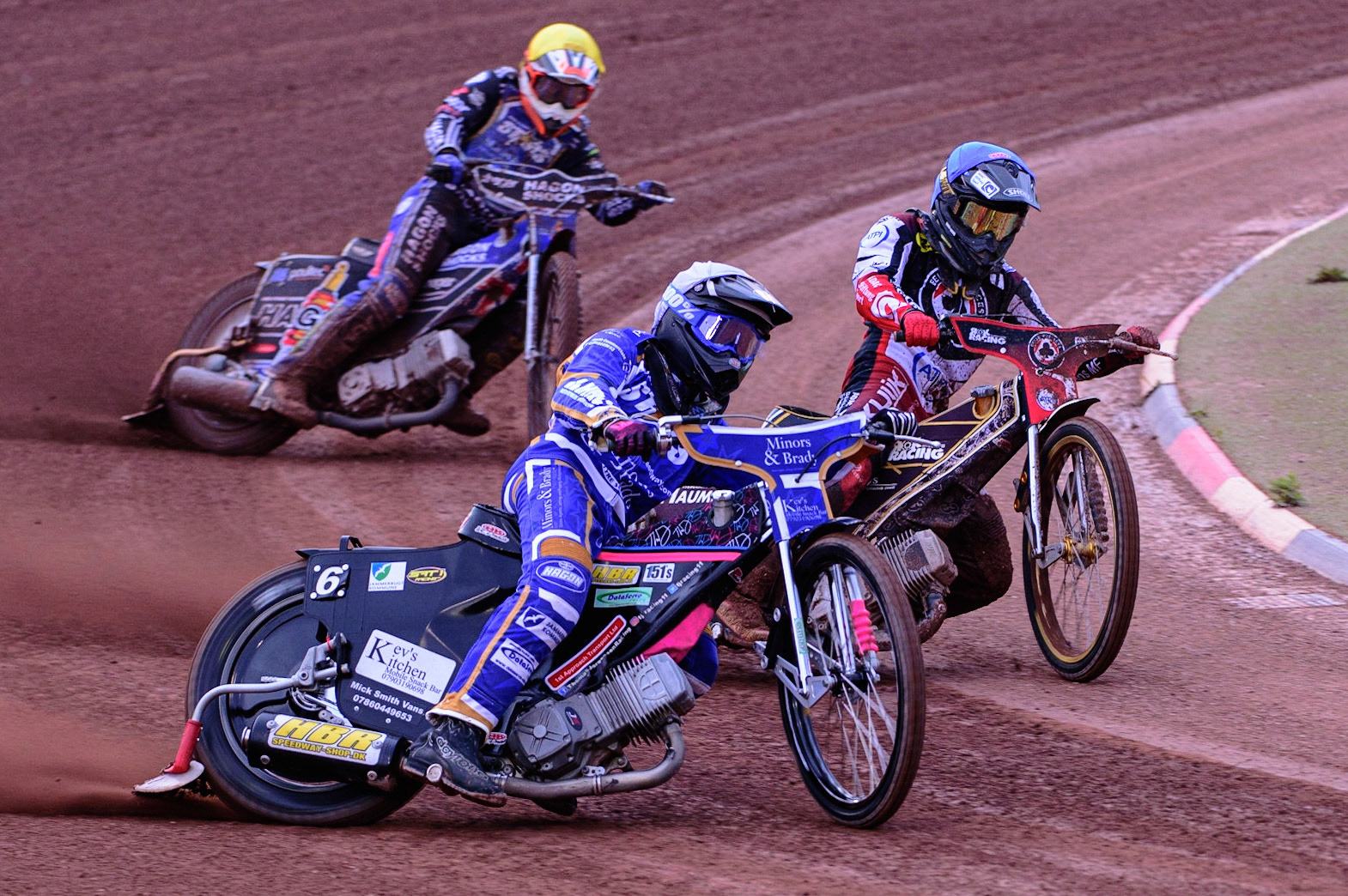 MANCHESTER UK  Thomas Jorgensen (White) outside Norick Blodorn  (Blue) with Jason Edwards  (Yellow) behind during the SGB Premiership match between Belle Vue Aces and King's Lynn Stars at the National Speedway Stadium, Manchester on Monday 11th July 2022. (Credit: Ian Charles | MI News)