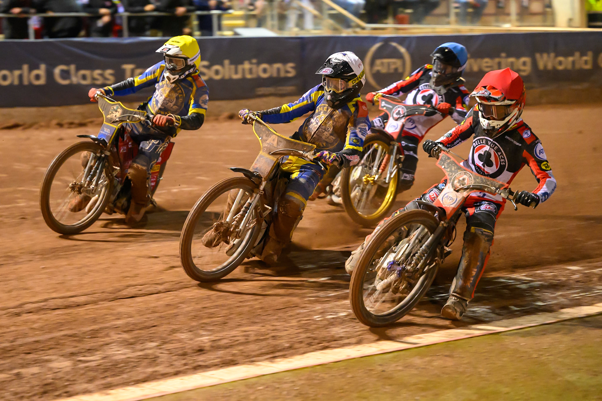 Zach Cook of Belle Vue Aces in Red on the inside of Josh Pickering of Sheffield Tigers in Yellow  and Max Fricke, Guest Rider for Sheffield Tigers in Yellow  with Norick Blodorn of Belle Vue Aces in Blue  behind during the Rowe Motor Oil Premiership Grand Final 2nd Leg between Belle Vue Aces and Sheffield Tigers at the National Speedway Stadium, Manchester on Friday 16th October 2026. (Photo: Ian Charles | MI News)