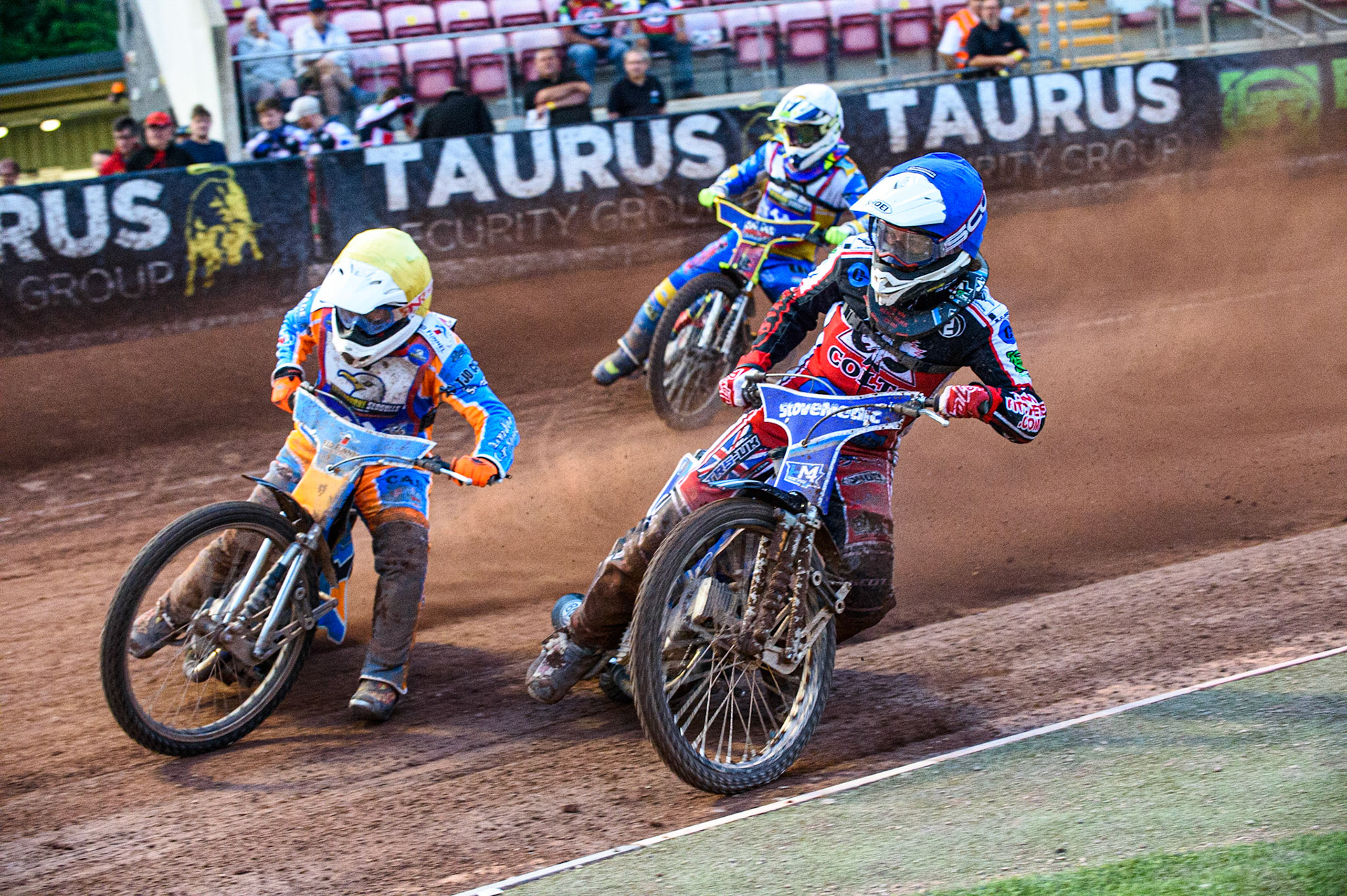 MANCHESTER, UK. JULY 23RD Danno Verge  (Yellow) outside Paul Bowen (Blue) with Nathan Ablitt  (White) behind during the National Development League match between Belle Vue Colts and Eastbourne Seagulls at the National Speedway Stadium, Manchester on Friday 23rd July 2021. (Credit: Ian Charles | MI News)