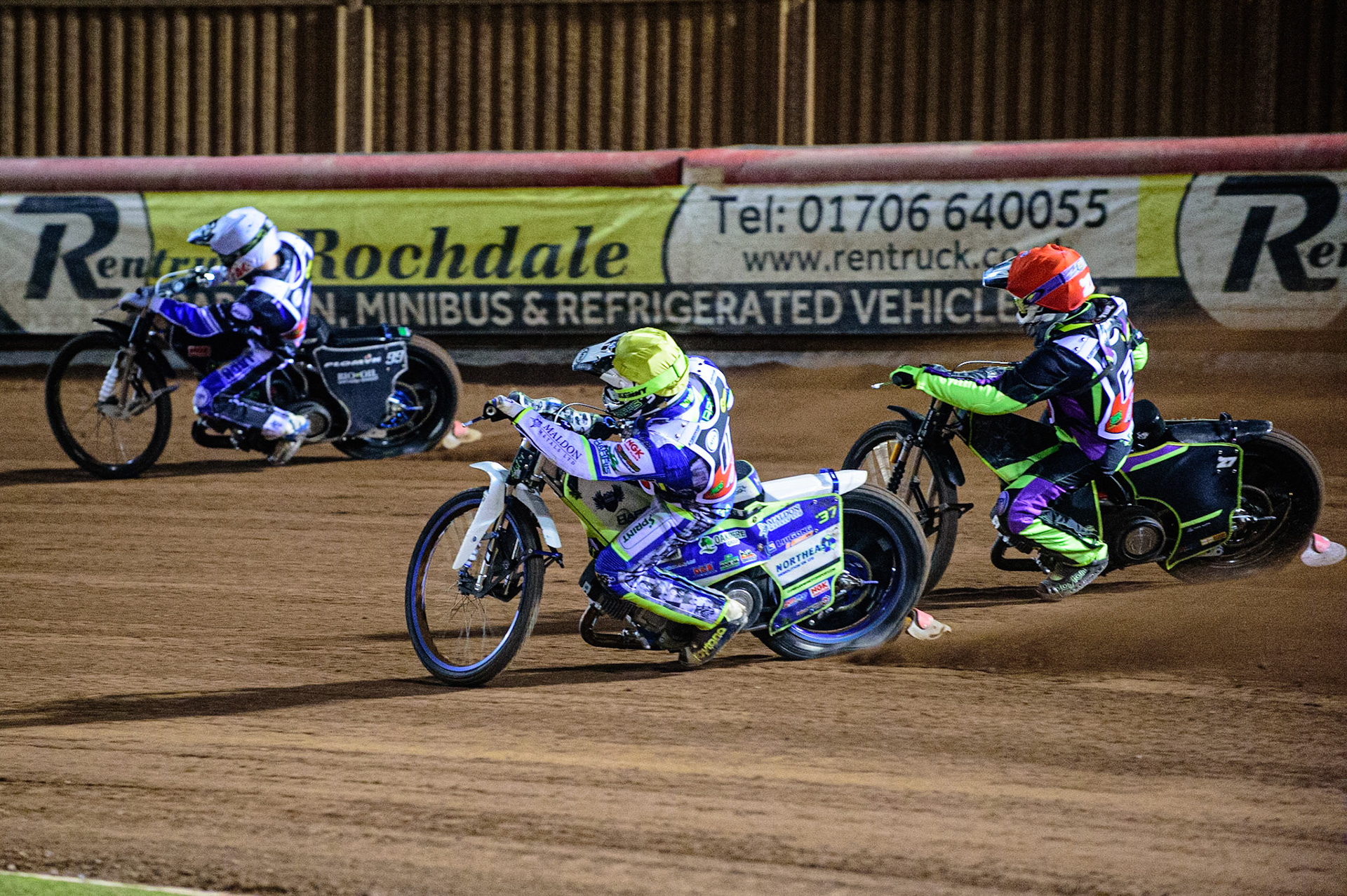 MANCHESTER, UK. OCT 23RD  Chris Harris  (Yellow) passes Tom Brennan  (Red) as they chase Dan Bewley (White) during the Peter Craven Memorial Trophy event at the National Speedway Stadium, Manchester on Saturday 23rd October 2021. (Credit: Ian Charles | MI News)