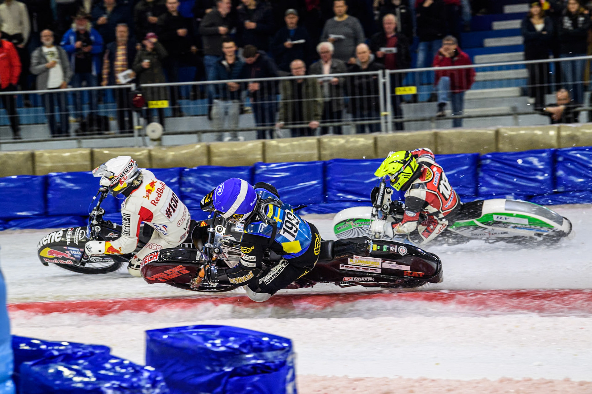 Sweden's Martin Haarahiltunen (199)  in Blue rides inside Austria's Franz Zorn (100) in White and Czech Republic's Andrej Diviš (107) in Yellow during the FIM Ice Speedway Gladiators World Championship Final 3 at Ice Rink Thialf, Heerenveen on Saturday 6th April 2024. (Photo: Ian Charles | MI News)