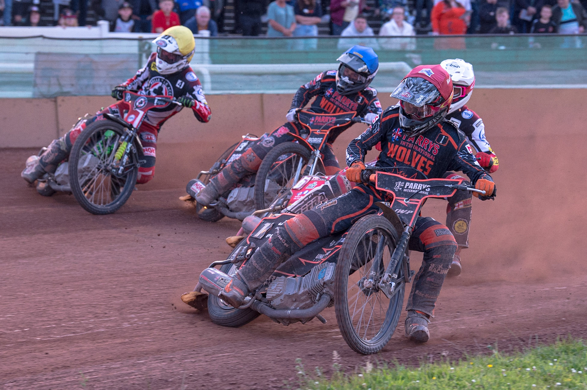 WOLVERHAMPTON, UK. JUN 20TH Sam Masters  (Red) leads Max Fricke  (White) Luke Bekker  (Blue) and Charles Wright  (Yellow) into the first turn during the SGB Premiership match between Wolverhampton Wolves and Belle Vue Aces at Monmore Green Stadium, Wolverhampton on Monday 20th June 2022. (Credit: Ian Charles | MI News)