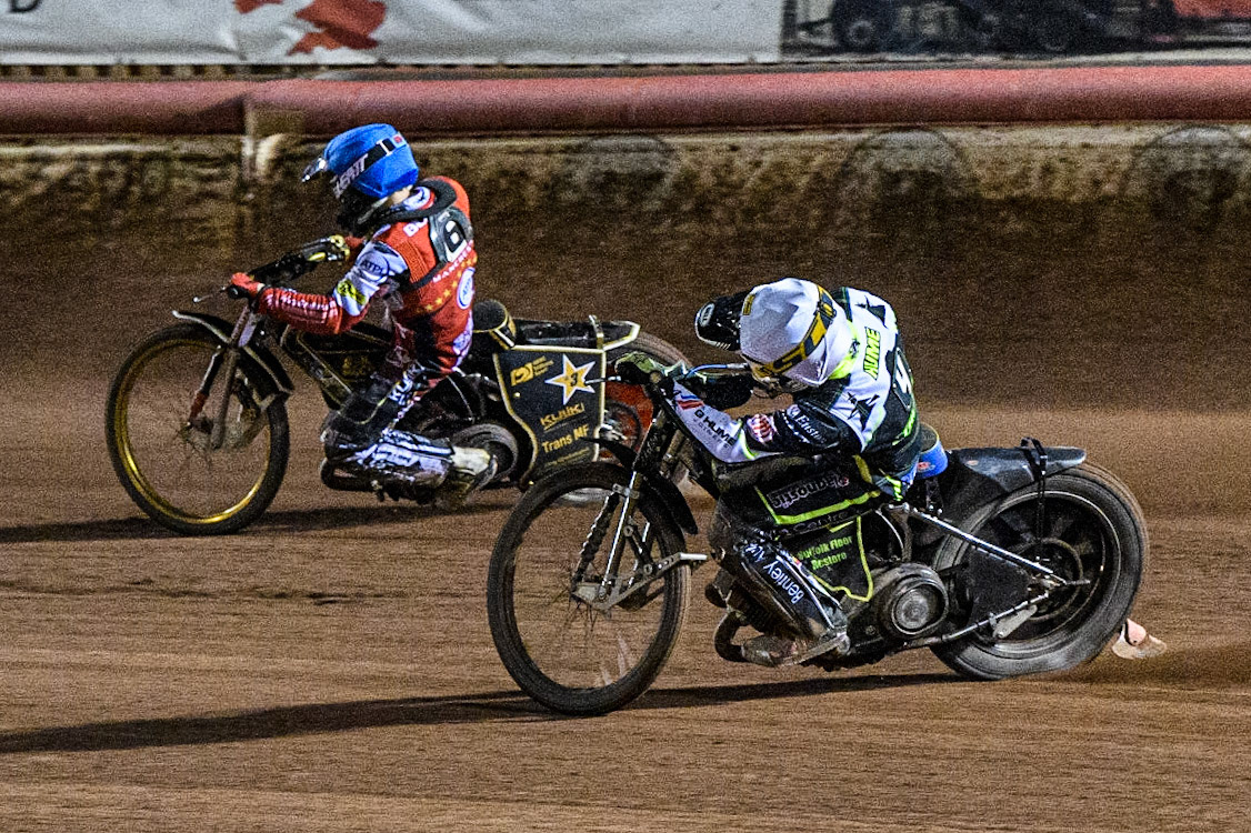 Danyon Hume (White) chases Norick Blodorn (Red) during the Sports Insure Premiership Semi Final Playoff 2nd leg match between Belle Vue Aces and Ipswich Witches at the National Speedway Stadium, Manchester on Monday 25th September 2023. (Photo: Ian Charles | MI News)