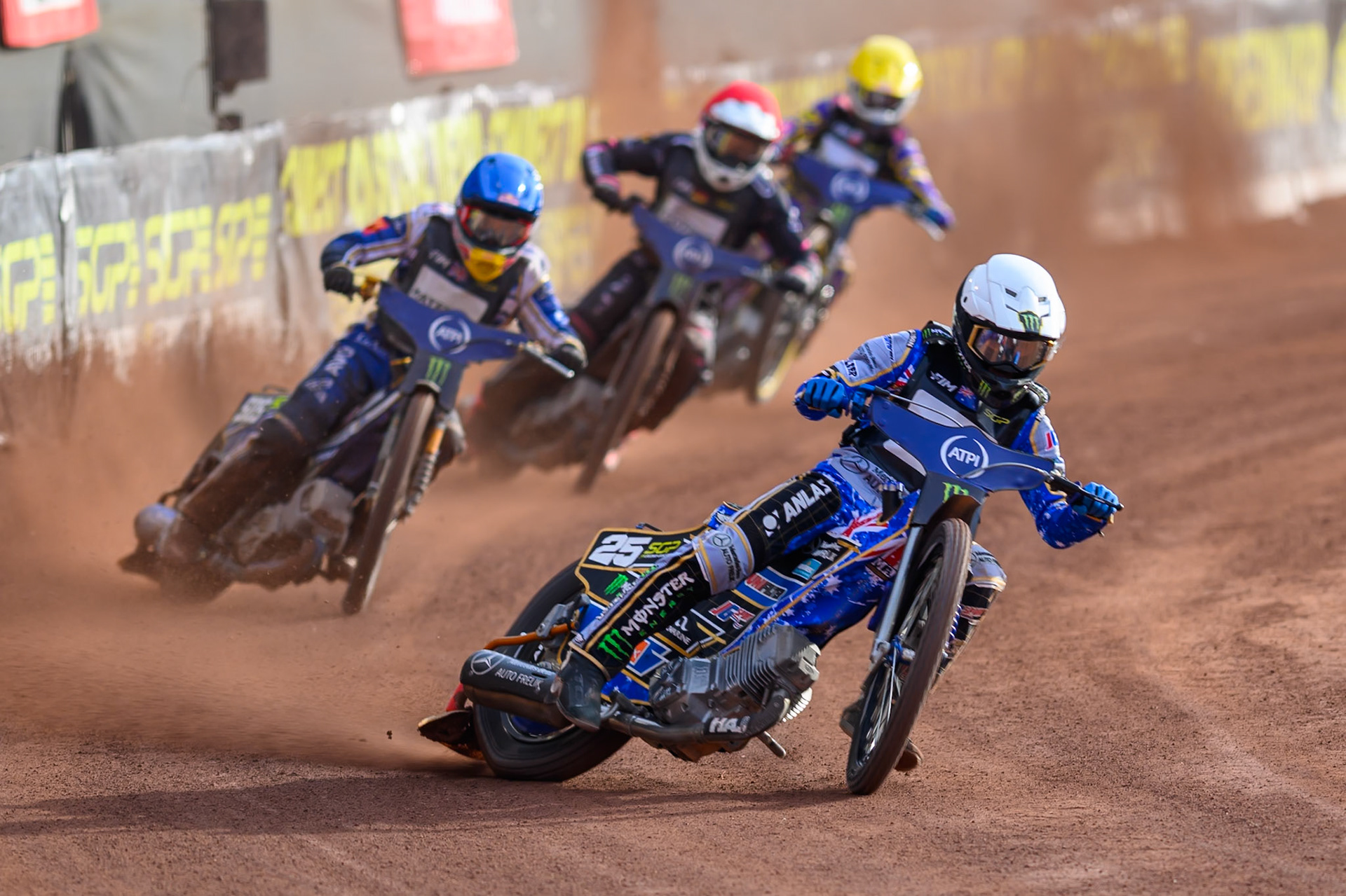 Jack Holder (25) of Australia in White leading Robert Lambert (505) of Great Britain  in Blue Kai Huckenbeck (744) of Germany in Red and Kacper Woryna (223) of Poland  in Yellow during the ATPI  FIM Speedway GP of Manchester at the National Speedway Stadium, Manchester on Friday 5th June 2026. (Photo: Ian Charles | MI News)