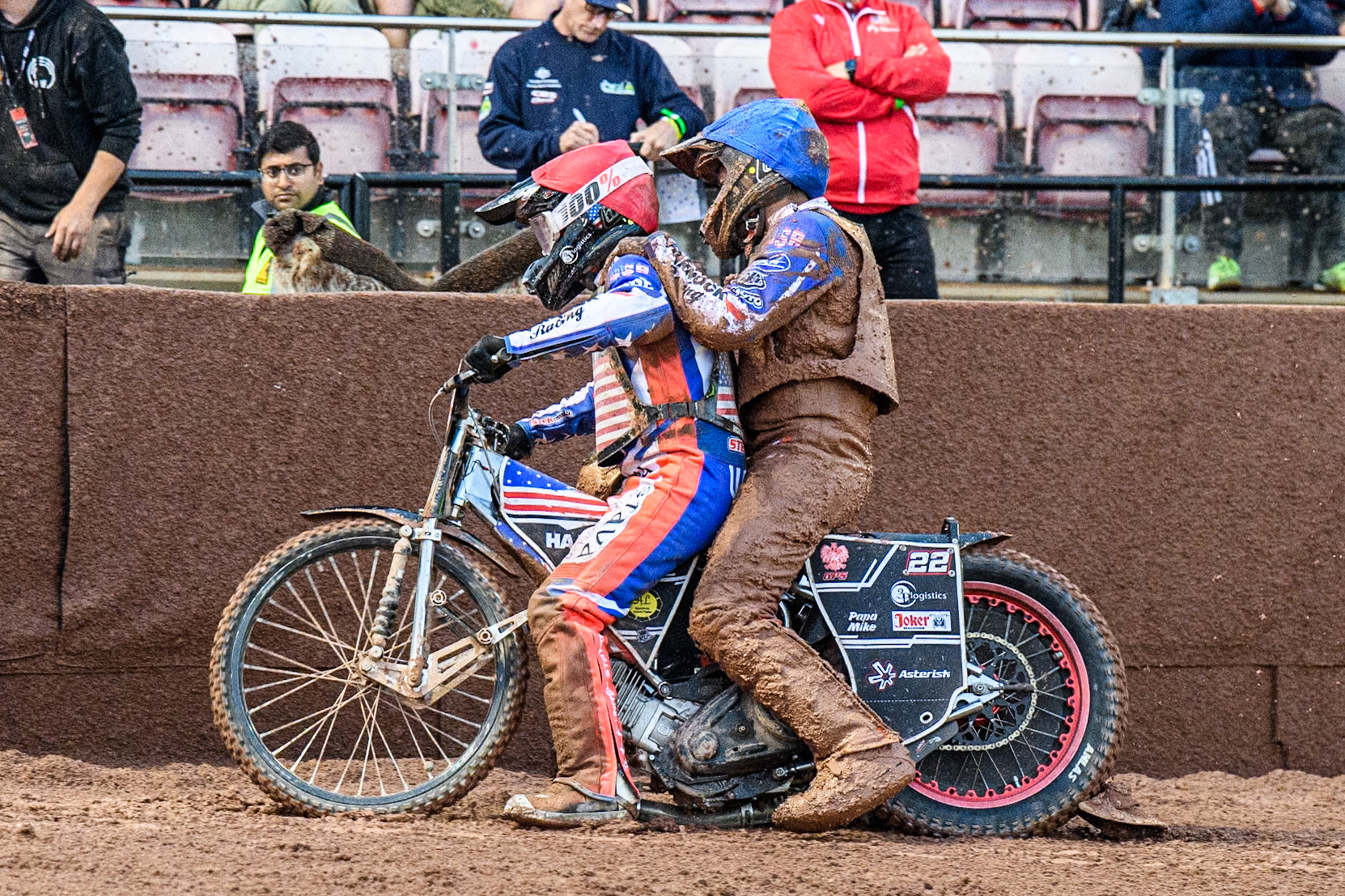Luke Becker of the USA gives team mate Gino Manzares a lift back to the pits after his fall during the Monster Energy FIM Speedway of Nation Semi Final 2 at the National Speedway Stadium, Manchester on Wednesday 10th July 2024. (Photo: Ian Charles | MI News)