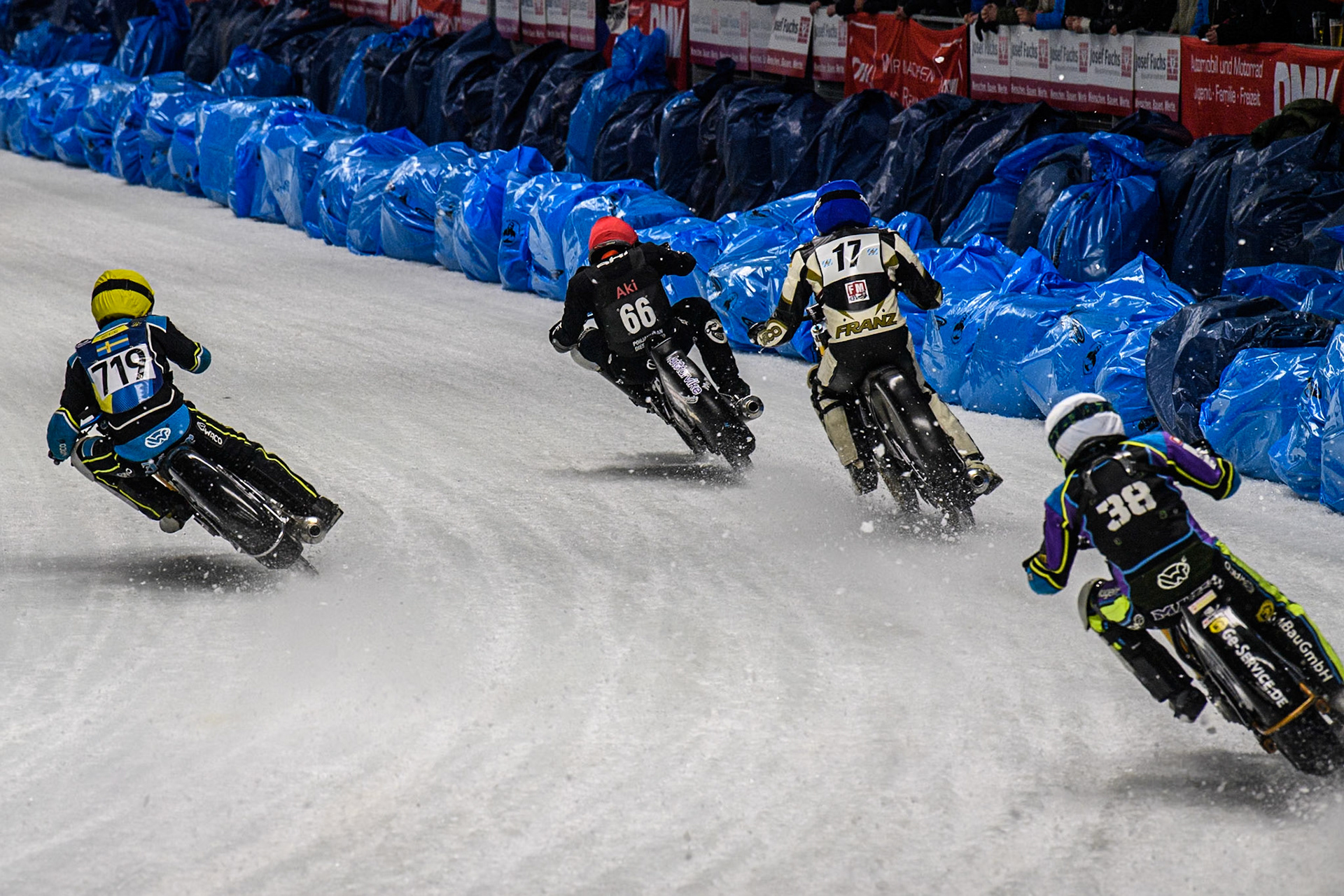 Filip Jäger (719) of Sweden in Yellow flies up the inside of Maximilian Niedermaier (38) of Germany in White, Reserve Franz Mayerbüchler (17) of Germany in Blue and Aki Ala-Riihimäki (66) of Finland in Red during the Ice Speedway Gladiators World Championship Final 2 at Max-Aicher-Arena, Inzell on Sunday 16th March 2025. (Photo: Ian Charles | MI News)