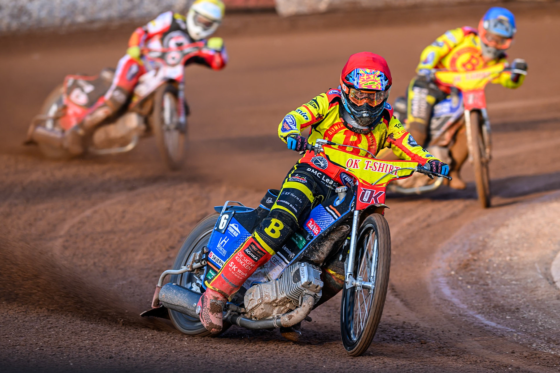 Birmingham Brummies' Jonas Jeppesen in Red leading Birmingham Brummies' Jason Edwards in Blue and Belle Vue Aces' Jake Mulford in Yellow during the Rowe Motor Oil Premiership match between Birmingham Brummies and Belle Vue Aces at Perry Bar Stadium, Birmingham on Monday 2nd June 2025. (Photo: Ian Charles | MI News)