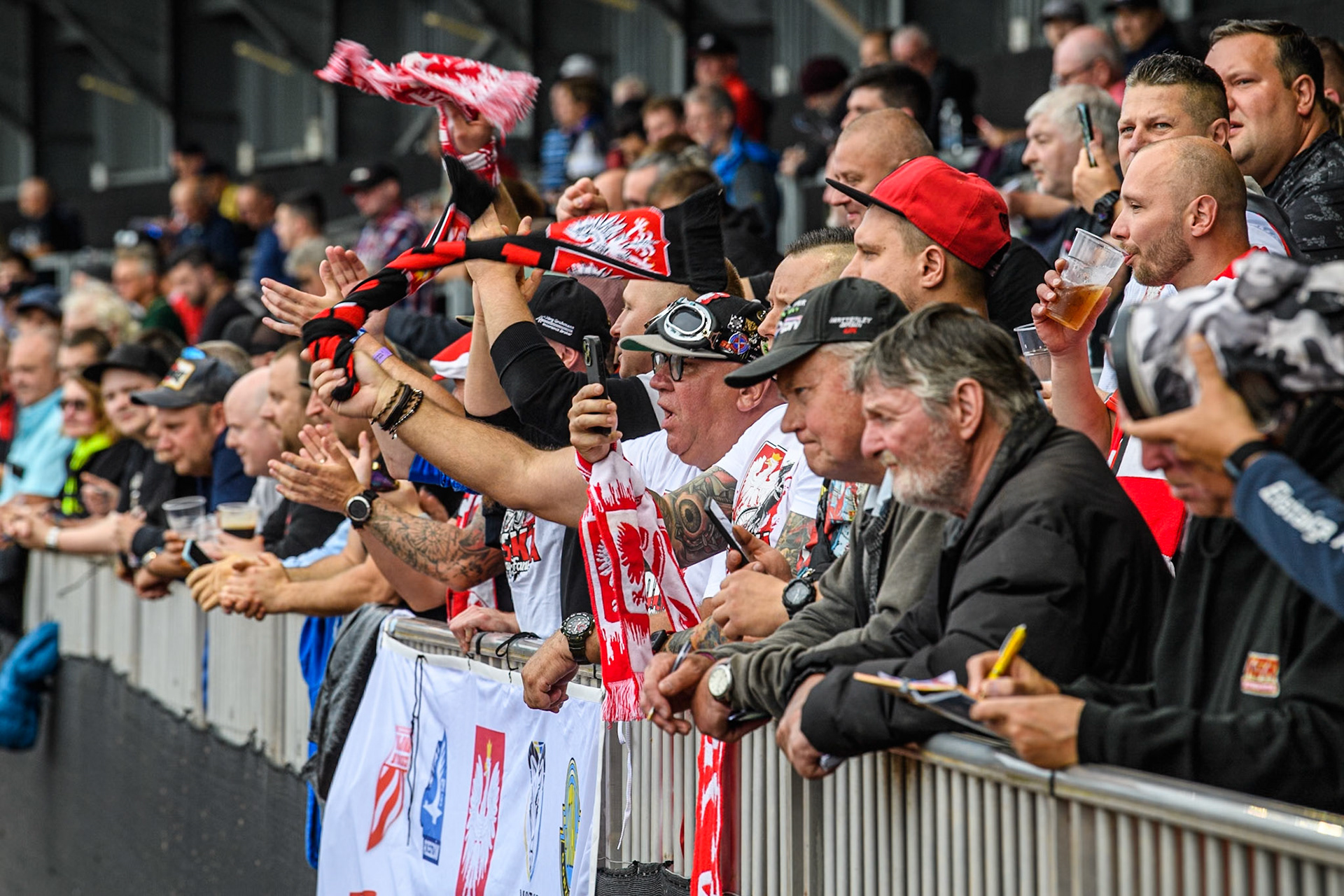 Polish fans celebrate their opening heat win during the Monster Energy FIM Speedway of Nations Semi-Final 1 at the National Speedway Stadium, Manchester on Tuesday 9th July 2024. (Photo: Ian Charles | MI News)