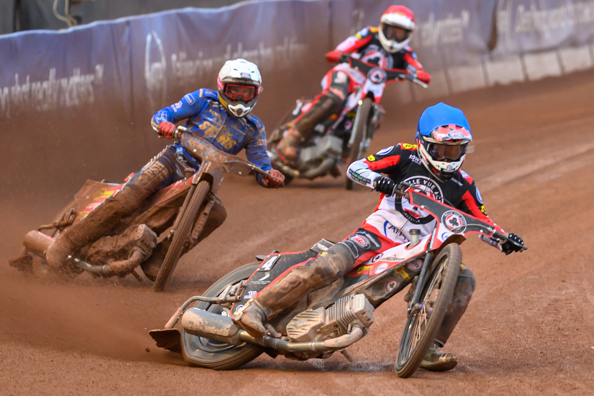 Zach Cook of Belle Vue Aces in Blue leading Max Fricke of Kings Lynn Stars in White  and Peter Kildemand of Belle Vue Aces in Red during the Rowe Motor Oil Premiership match between Belle Vue Aces and King's Lynn Stars at the National Speedway Stadium, Manchester on Monday 29th June 2026. (Photo: Ian Charles | MI News)
