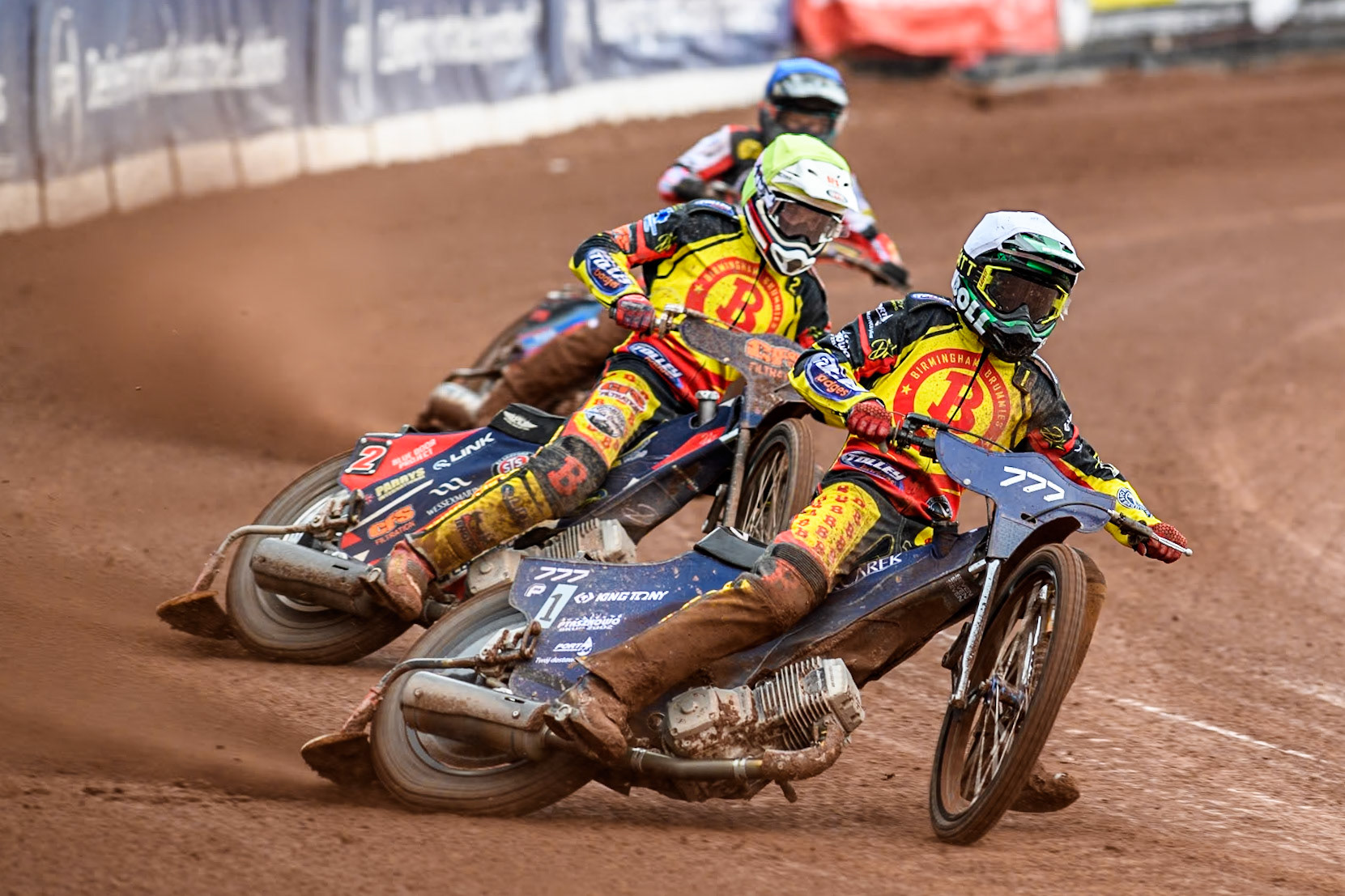 Birmingham Brummies' Piotr Pawlicki  in White and Birmingham Brummies' Steve Worrall  in Yellow leading Belle Vue Aces' Ben Cook  in Blue during the Rowe Motor Oil Premiership match between Belle Vue Aces and Birmingham Brummies at the National Speedway Stadium, Manchester on Monday 6th May 2024. (Photo: Ian Charles | MI News)