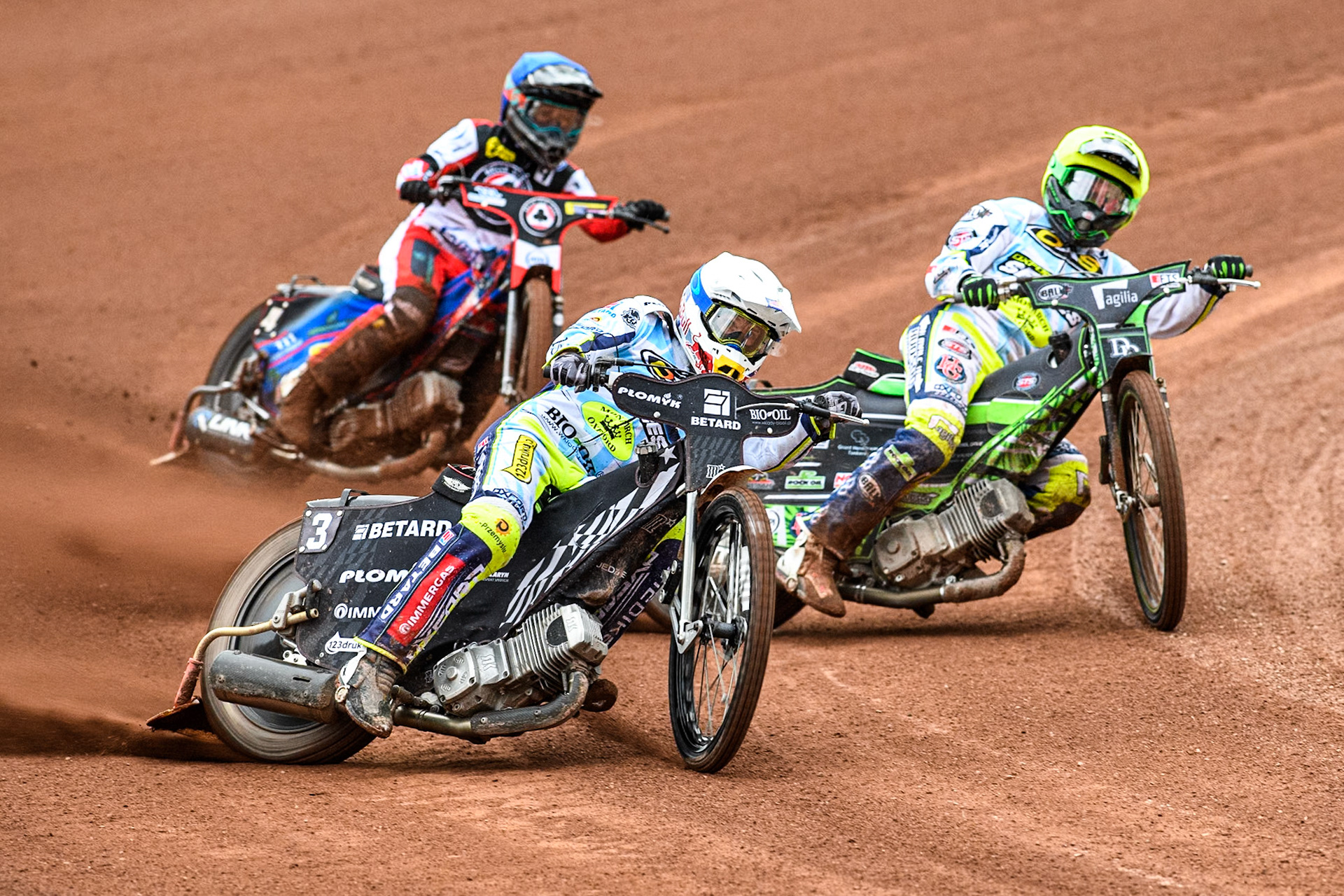 os3\ in White leading team mate Charles Wright in White and Belle Vue Aces' Ben Cook in Blue during the Rowe Motor Oil Premiership match between Belle Vue Aces and Oxford Spires at the National Speedway Stadium, Manchester on Monday 22nd July 2024. (Photo: Ian Charles | MI News)