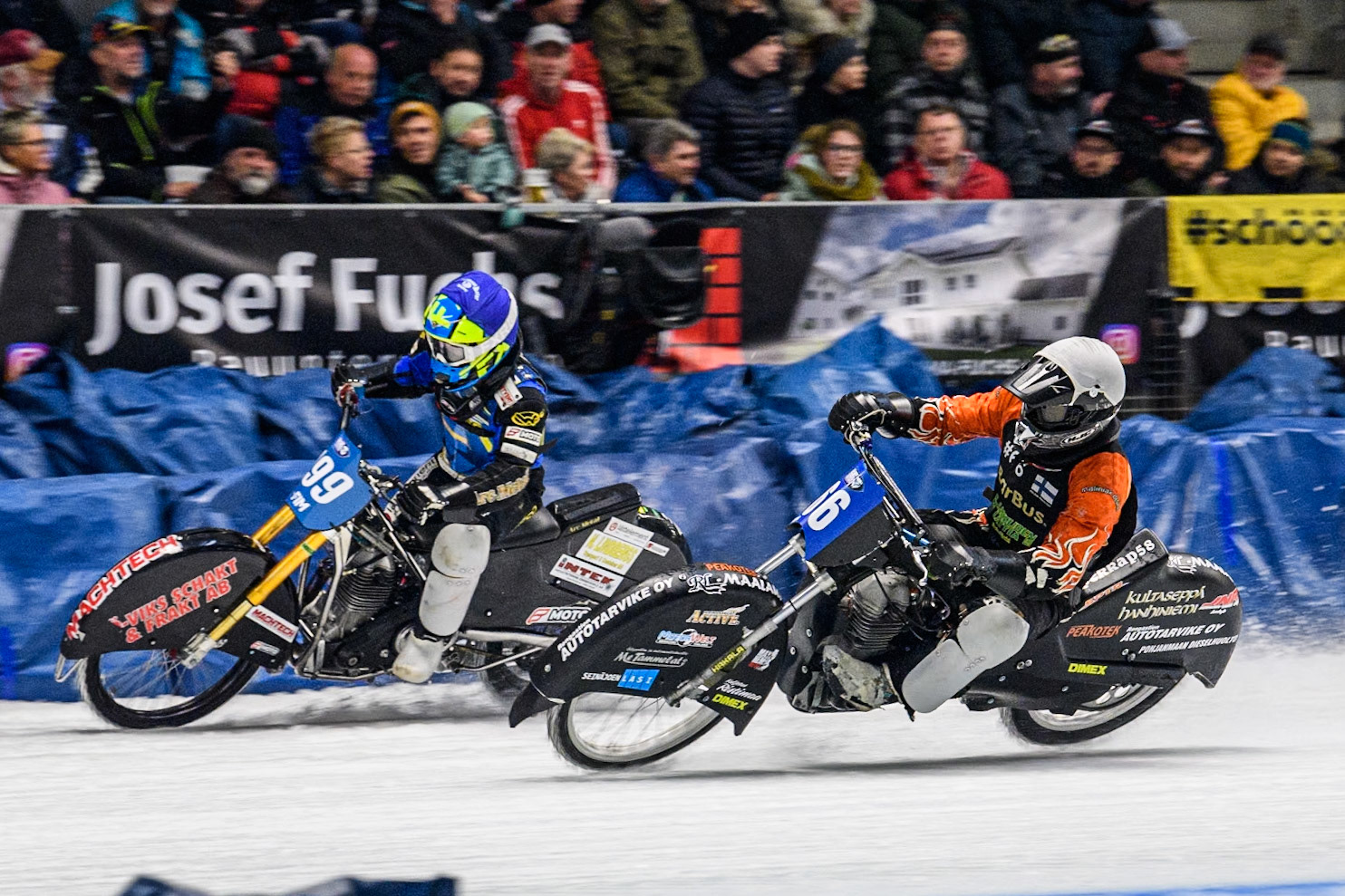 Finland's Aki Ala-Riihimäki (66) (White) inside Sweden's Martin Haarahiltunen (199)  (Blue) during the FIM Ice Speedway Gladiators World Championship Final 2 at the Max-Aicher-Arena, Inzell on Sunday 24 March 2024. (Photo: Ian Charles | MI News)