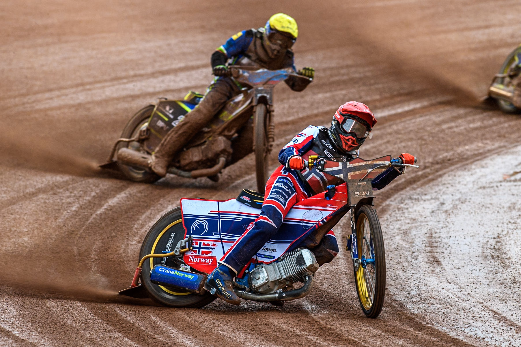 Mathias Pollestad of Norway in Red leading Matic Ivacic of Slovenia in Yellow and Anze Grmek of Slovenia in White during the Monster Energy FIM Speedway of Nation Semi Final 2 at the National Speedway Stadium, Manchester on Wednesday 10th July 2024. (Photo: Ian Charles | MI News)