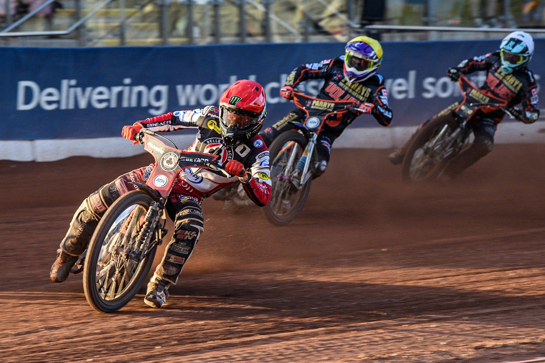 Dan Bewley (Red) leads Rory Schlein (Yellow) and Ryan Douglas (White) during the Sports Insure Premiership match between Belle Vue Aces and Wolverhampton Wolves at the National Speedway Stadium, Manchester on Monday 3rd July 2023. (Photo: Ian Charles | MI News)