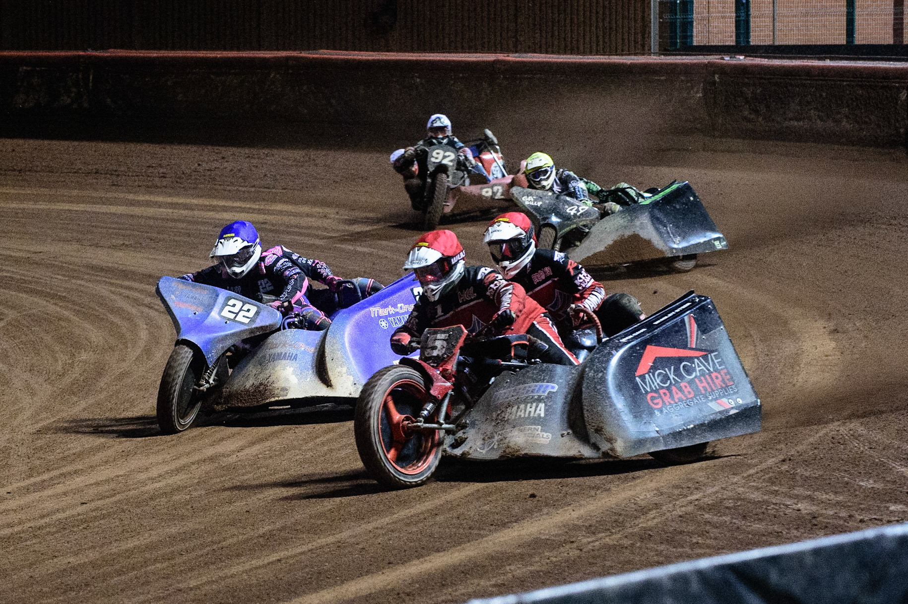 MANCHESTER, UK. OCT 30TH   Mick Cave &amp; Bradley Steer  (Red) leads Will Penfold &amp; Ricky Pay  (Blue) Gareth Winterburn &amp; Bradley Atkinson  (Yellow) and Paul Whitelam &amp; Richard Webb (White) in the last chance semi final during the Manchester Masters Sidecar Speedway and Flat Track Racing at the National Speedway Stadium, Manchester on Saturday 30th October 2021. (Credit: Ian Charles | MI News)