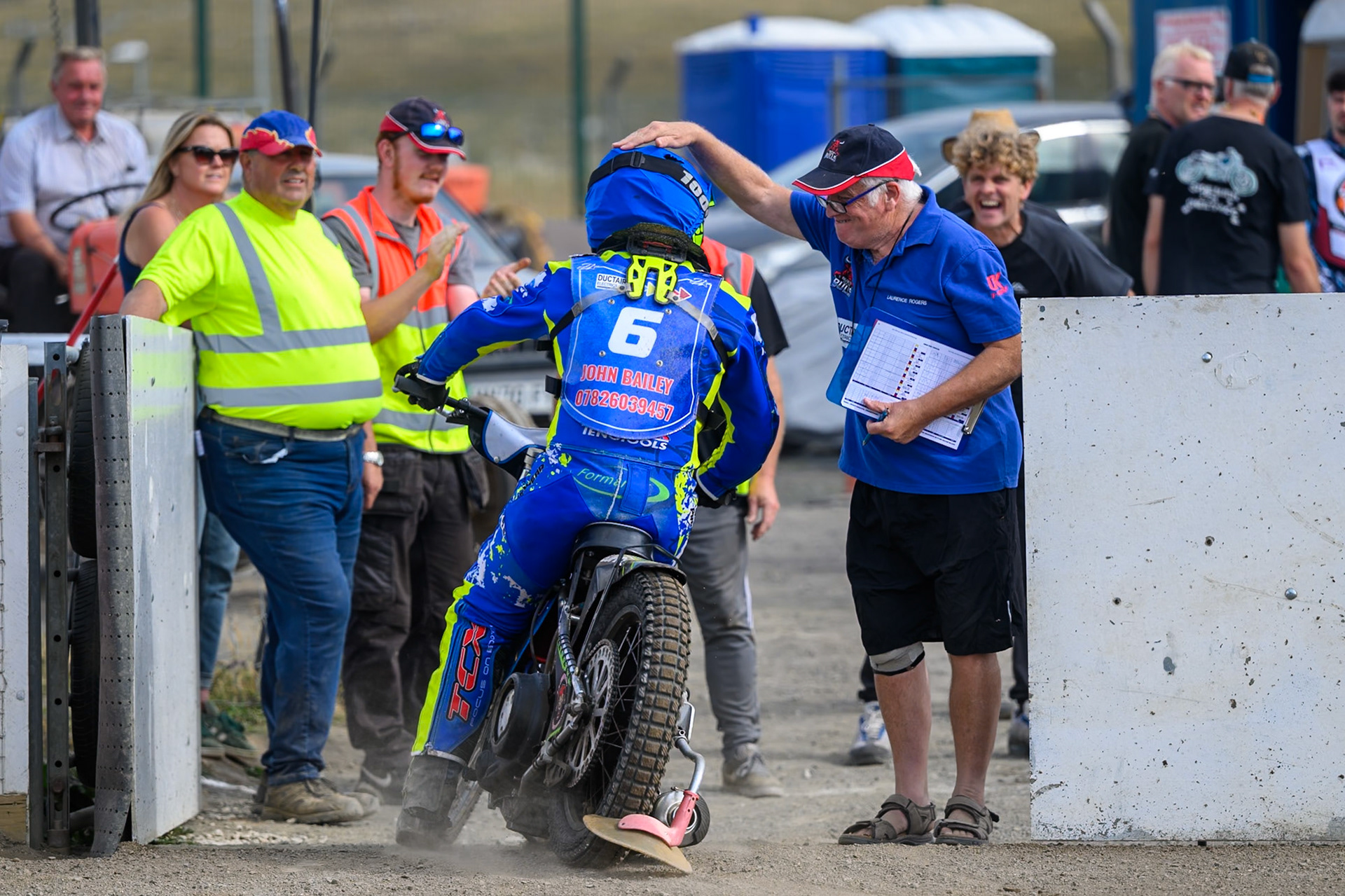 Laurence Rogers, Team Manager of Buxton Bulls ri\ congratulates Will Boraston of Buxton Bulls  on his best performance of the meeting during the WSRA National Development League match  between Buxton Bulls and Middlesborough Tigers at Hi-Edge Speedway, Buxton on Sunday 16th August 2026. (Photo: Ian Charles | MI News)