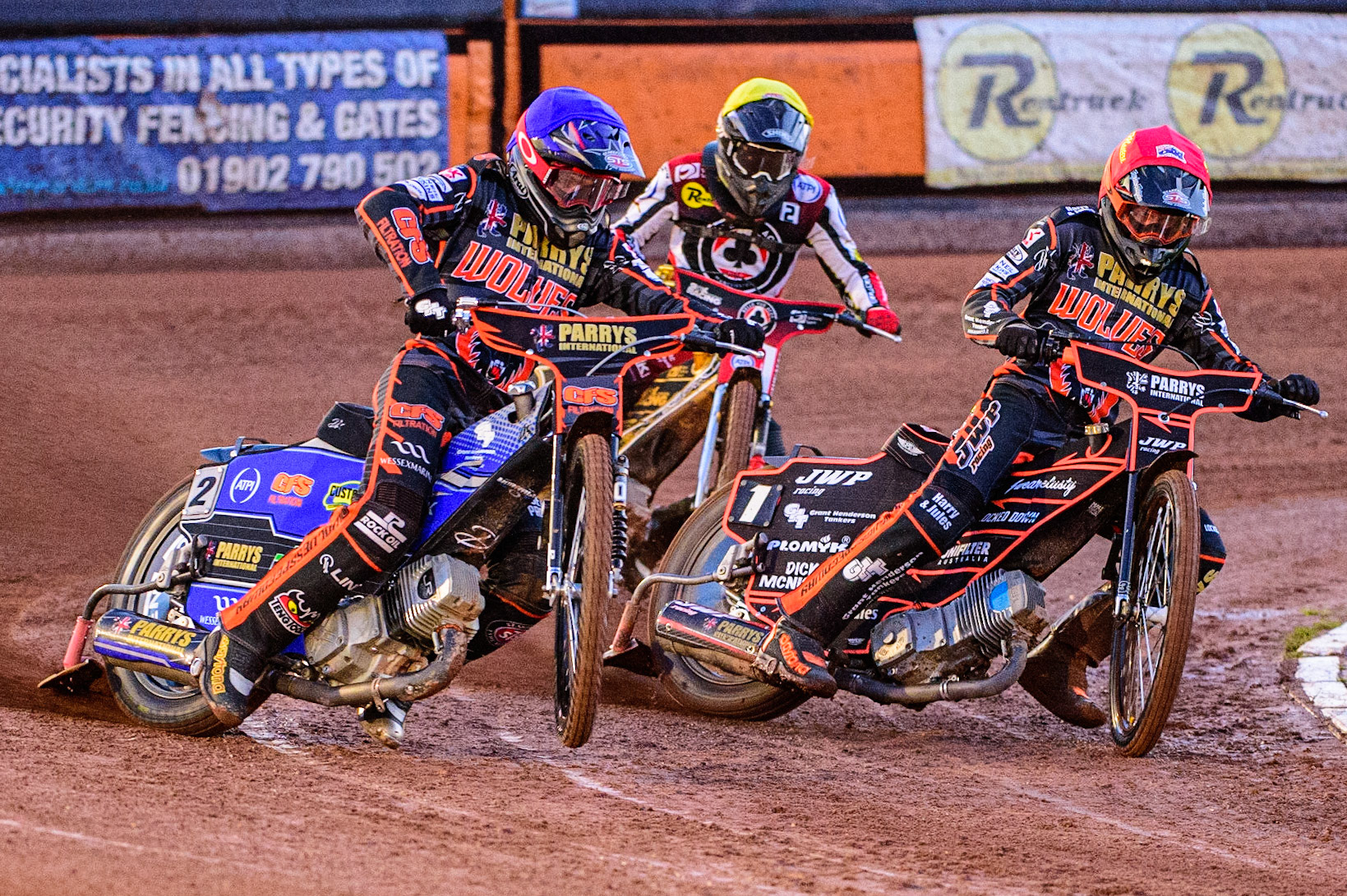 Steve Worrall (Blue) picks up some drive outside Sam Masters  (Red) with Norick Blodorn  (Yellow) behind during the SGB Premiership Knock Out Cup Quarter Final 1st Leg between Wolverhampton Wolves and Belle Vue Aces at Monmore Green Stadium, Wolverhampton on Monday 10th April 2023. (Photo: Ian Charles | MI News)