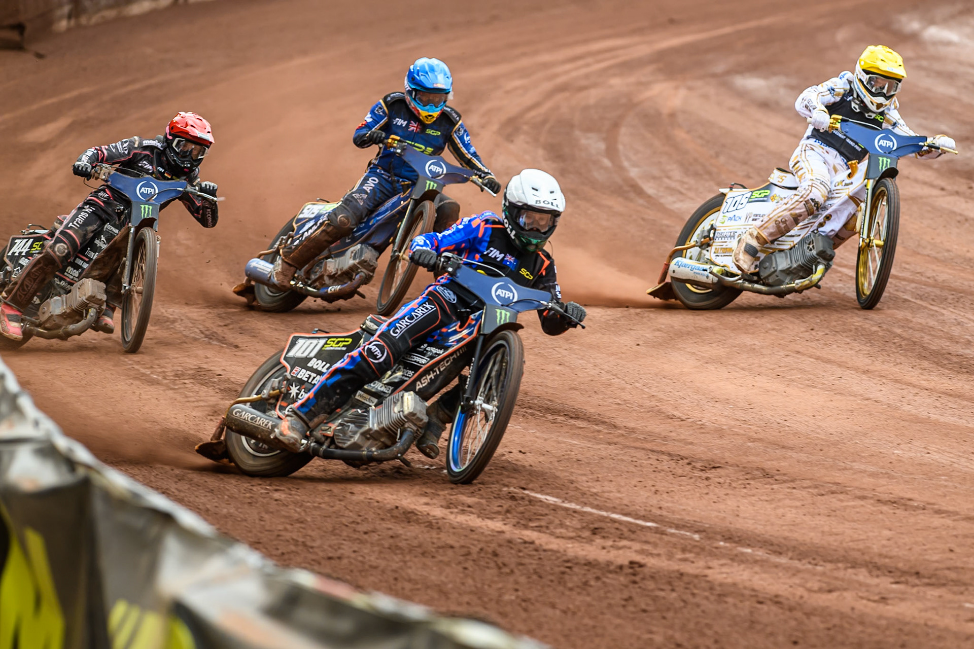 Brady Kurtz (101) of Australia in White leading Mikkel Michelsen (155) of Denmark in Yellow, Robert Lambert (505) of Great Britain in Blue and Kai Huckenbeck (744) of Germany in Red during the ATPI FIM Speedway Grand Prix Round 4 at the National Speedway Stadium, Manchester, on Friday 13th June 2025. (Photo: Ian Charles | MI News)