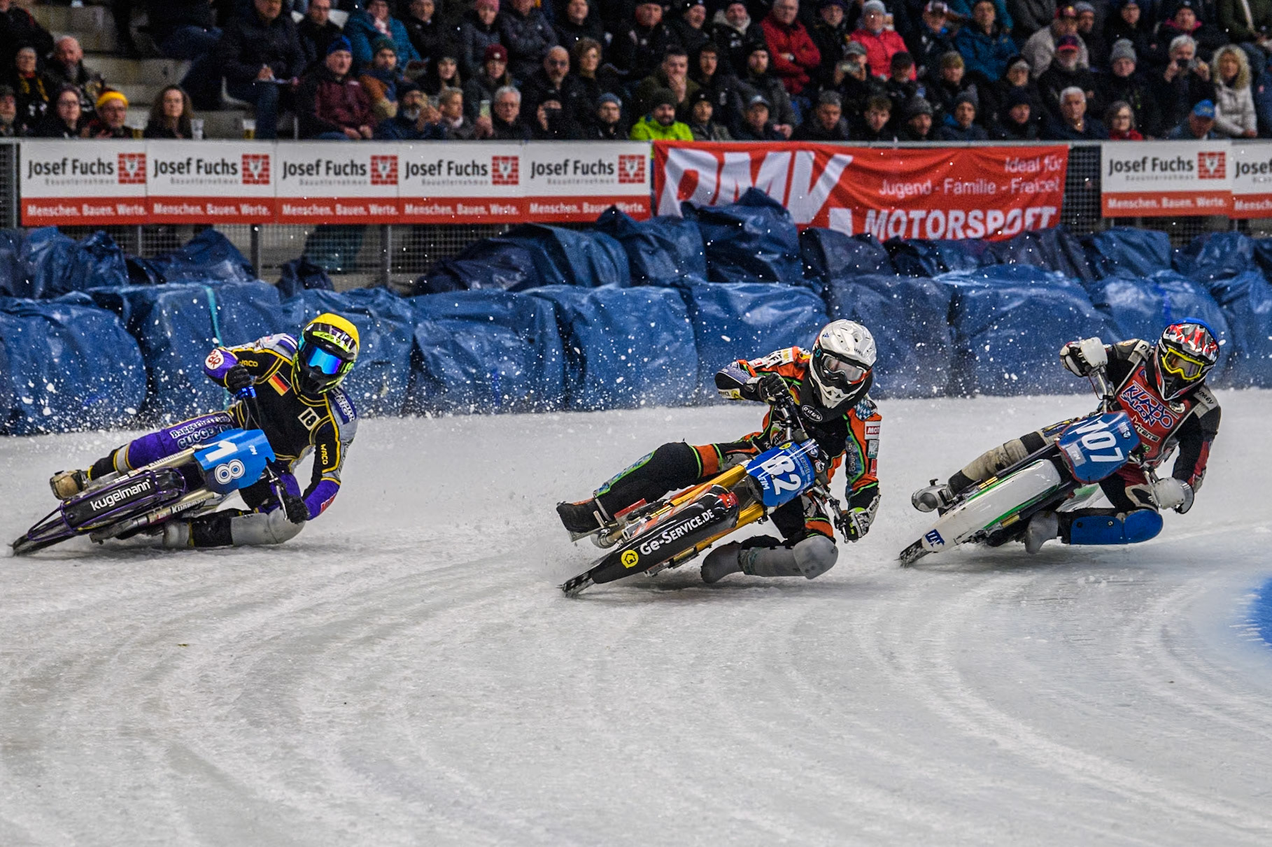Germany's Markus Jell (82) (White) leads  Germany's Christoph Kirchner (18) (Yellow) and Czech Republic's Andrej Diviš (107) (Blue) during the FIM Ice Speedway Gladiators World Championship Final 2 at the Max-Aicher-Arena, Inzell on Sunday 24 March 2024. (Photo: Ian Charles | MI News)