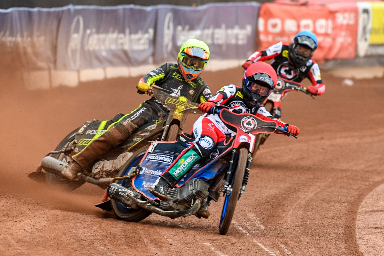 Belle Vue Aces' Brady Kurtz  in Red leading Ipswich Witches' Keynan Rew in Yellow and Belle Vue Aces' Norick Blodorn  in Blue during the Rowe Motor Oil Premiership match between Belle Vue Aces and Ipswich Witches at the National Speedway Stadium, Manchester on Monday 1st July 2024. (Photo: Ian Charles | MI News)