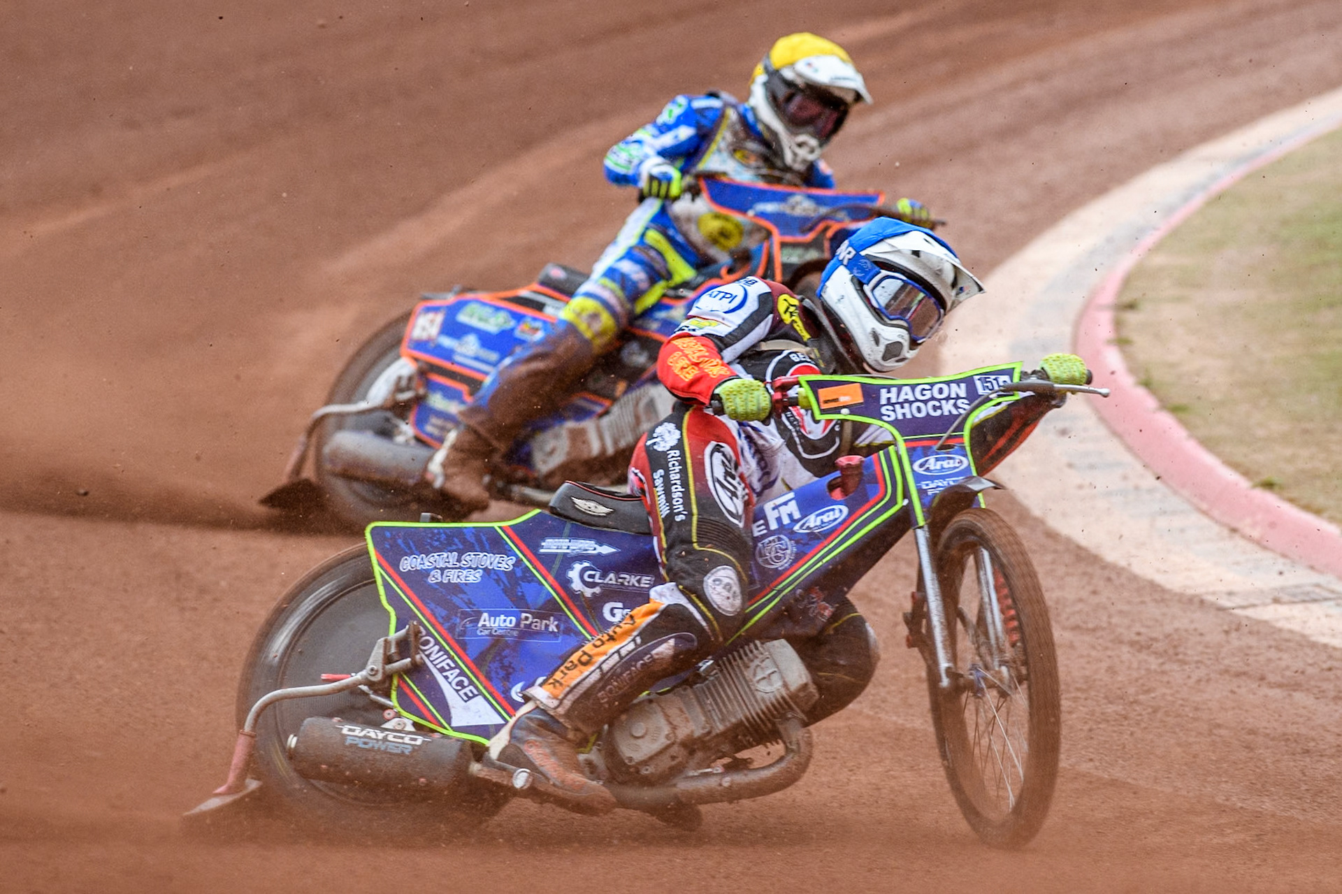 Belle Vue Aces' guest Jake Mulford  in Blue leading Oxford Spires' Luke Killeen  in Yellow during the Rowe Motor Oil Premiership match between Belle Vue Aces and Oxford Spires at the National Speedway Stadium, Manchester on Monday 22nd July 2024. (Photo: Ian Charles | MI News)