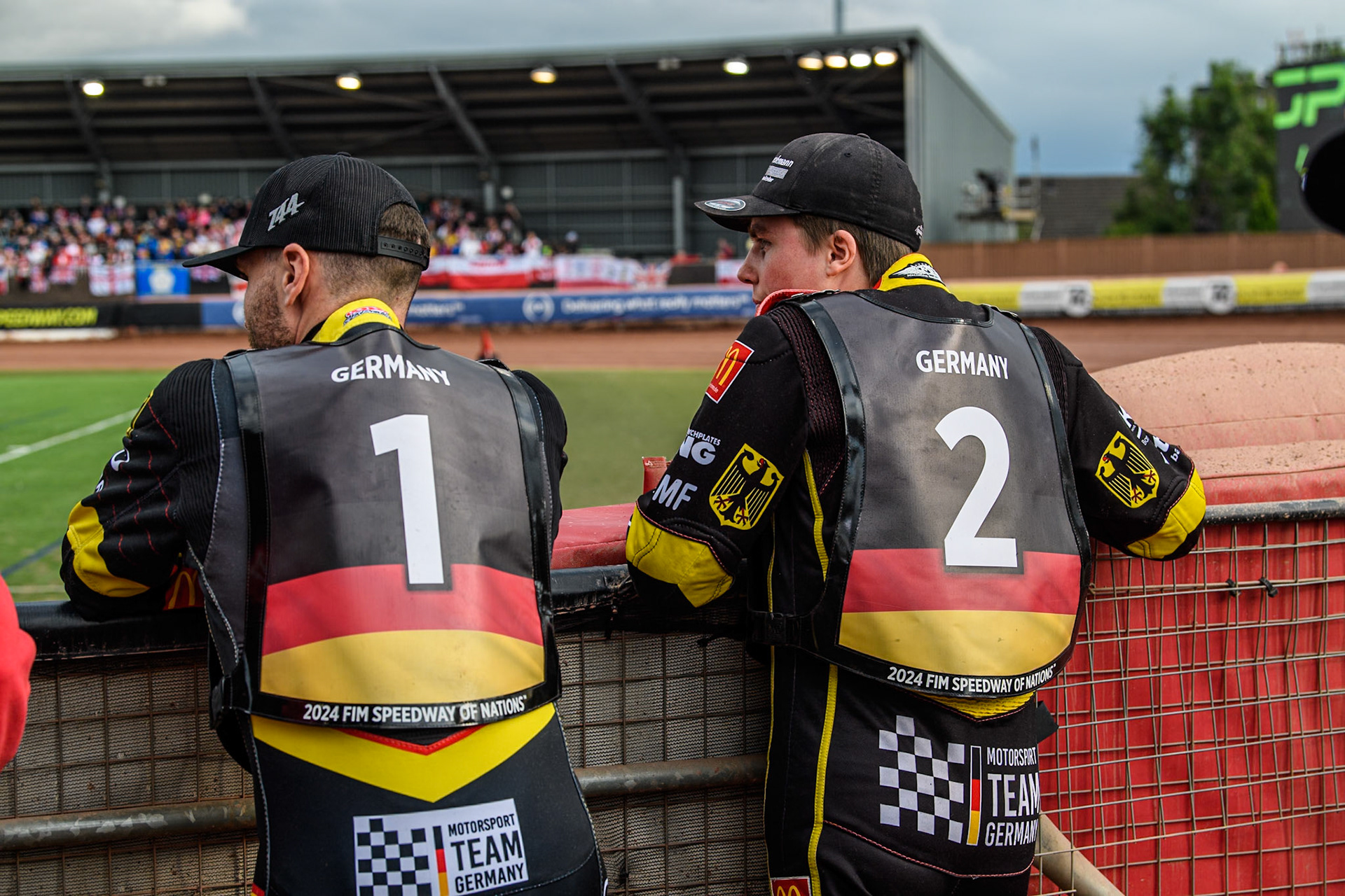 Kai Huckenbeck of Germany (Left) and Norick Blödorn of Germany watch the pre meeting track prep during the Monster Energy FIM Speedway of Nation Final at the National Speedway Stadium, Manchester on Saturday 13th July 2024. (Photo: Ian Charles | MI News)