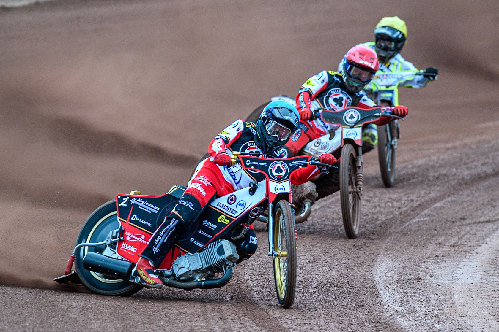 Belle Vue Aces' Norick Blodorn in Blue leading Belle Vue Aces' Brady Kurtz in Red and Oxford Spires' Erik Riss in Yellow during the Rowe Motor Oil Premiership match between Belle Vue Aces and Oxford Spires at the National Speedway Stadium, Manchester on Monday 14th April 2025. (Photo: Ian Charles | MI News)