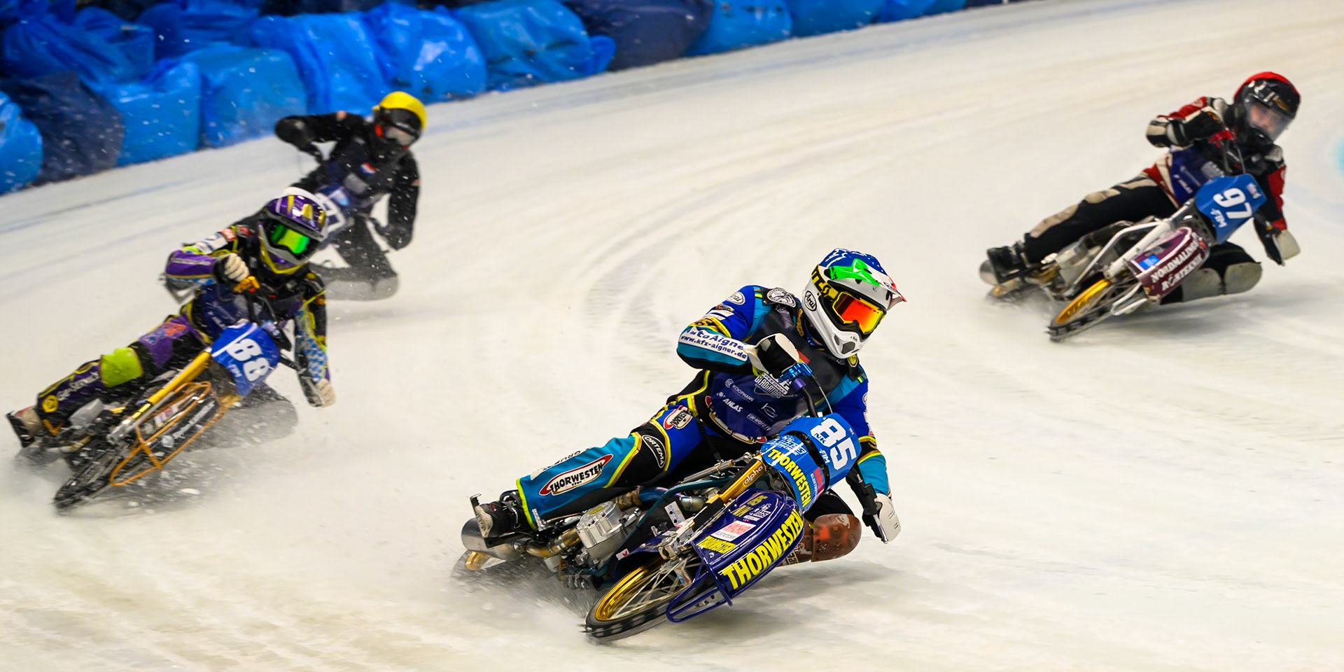 Luca Bauer (85) of Italy/Germany in Blue leading Ove Ledström (97) of Sweden in Red, Max Niedermaier (88) of Germany in White and Leon Kramer (777) of The Netherlands in Yellow during the Ice Speedway Gladiators World Championship Final 2 at Max-Aicher-Arena, Inzell on Sunday 15th March 2026. (Photo: Ian Charles | MI News)
