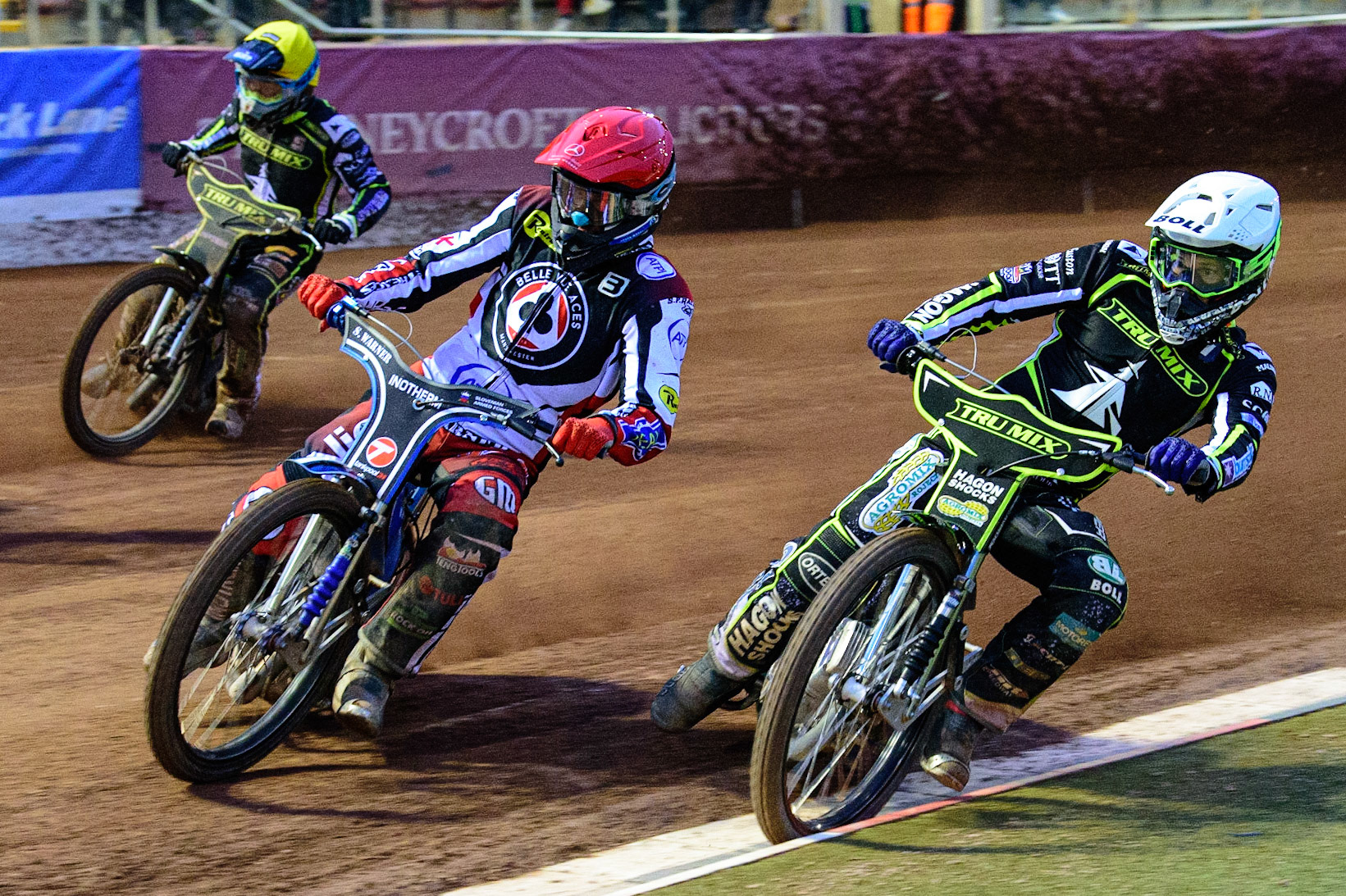 MANCHESTER, UK. JUN 6TH  Matej Žagar  (Red) outside Jason Doyle  (White) with Troy Batchelor  (Yellow) behind during the SGB Premiership match between Belle Vue Aces and Ipswich Witches at the National Speedway Stadium, Manchester on Monday 6th June 2022. (Credit: Ian Charles | MI News)