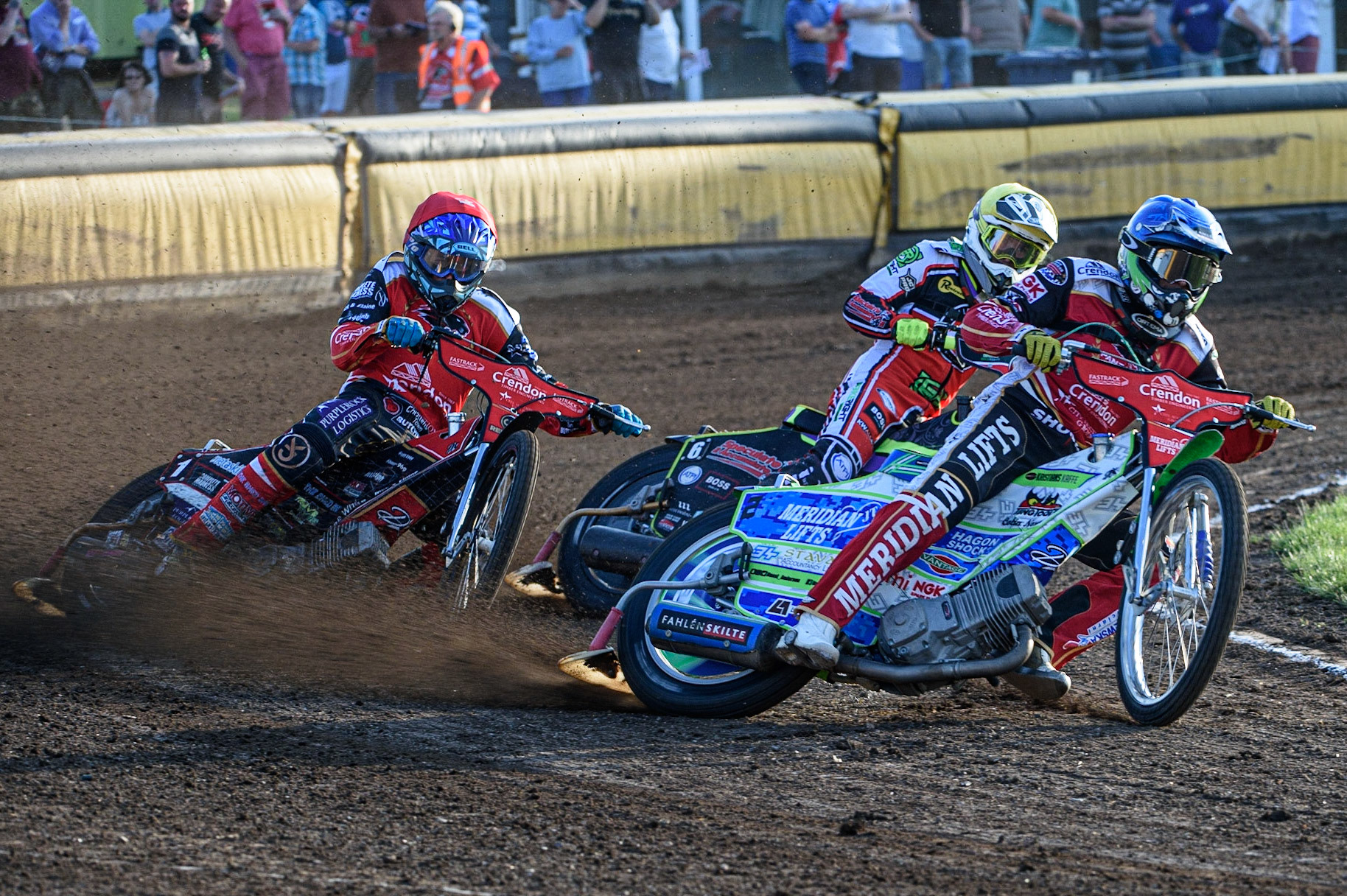 PETERBOROUGH, UK. JULY 19TH  Hans Andersen  (Blue) leads Tom Brennan  (Yellow) and Ulrich Ostergaard  (Red) during the SGB Premiership match between Peterborough and Belle Vue Aces at East of England Showground, Peterborough on Monday 19th July 2021. (Credit: Ian Charles | MI News)