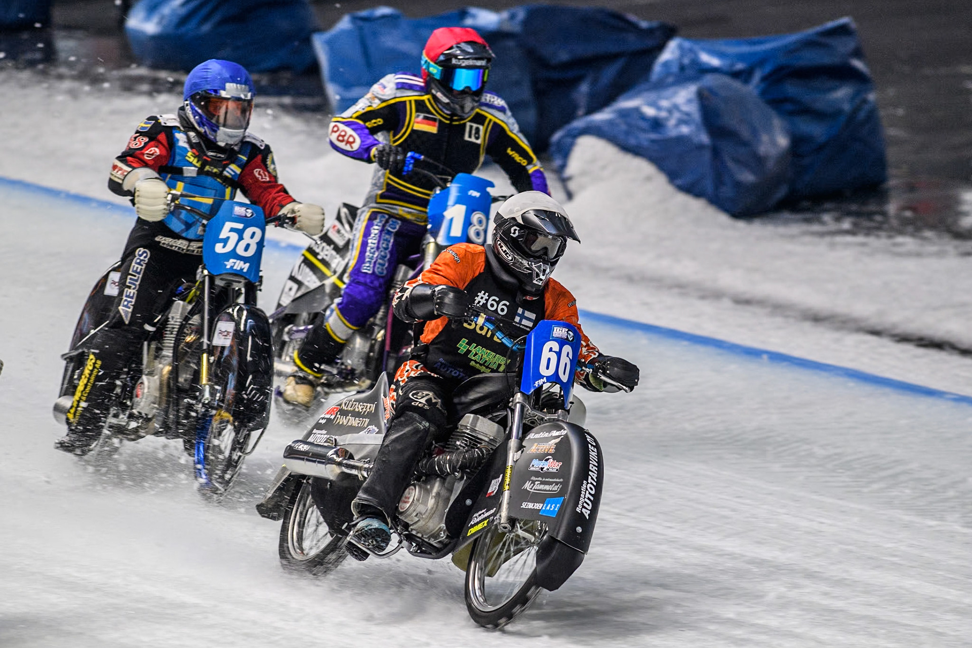Finland's Aki Ala-Riihimäki (66) (White) leads  Sweden's Stefan Svensson (58) (Blue) and Germany's Christoph Kirchner (18) (Red) during the FIM Ice Speedway Gladiators World Championship Final 2 at the Max-Aicher-Arena, Inzell on Sunday 24 March 2024. (Photo: Ian Charles | MI News)
