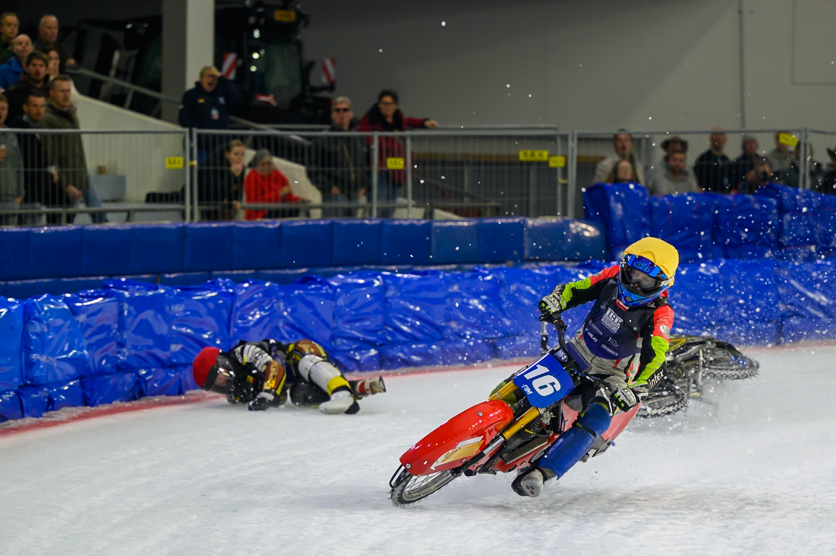 Heikki Huusko (67) of Finland  collides with Wild Card Harald Simon (16) of Austria in Yellow in the first turn during the FIM Ice Speedway Gladiators World Championship Final 3 at Ice Rink Thialf, Heerenveen on Saturday 11th April 2026. (Photo: Ian Charles | MI News)