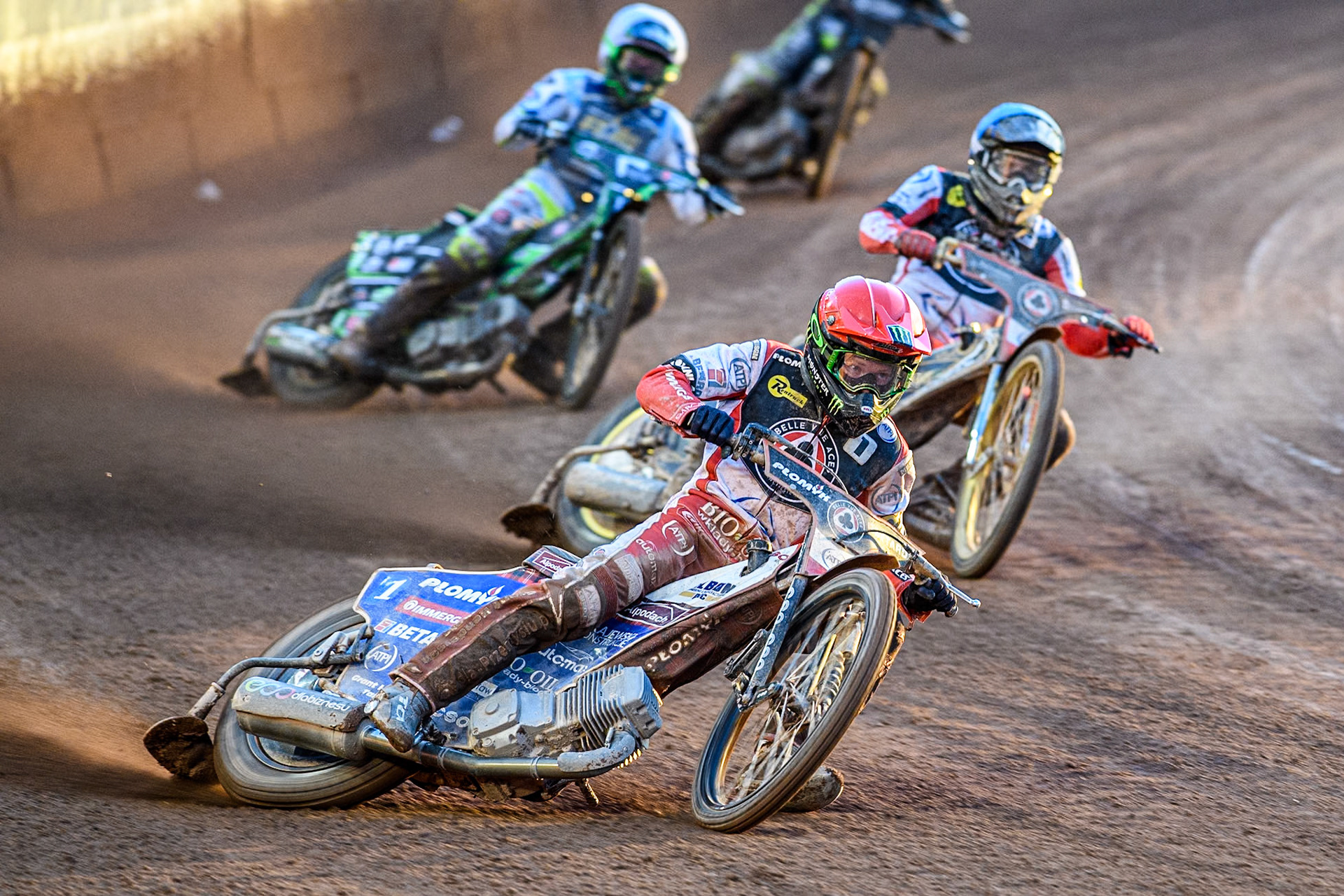 Belle Vue Aces' Dan Bewley  in Red and Belle Vue Aces' Norick Blodorn  in Blue leading Kings Lynn Stars' Guest Rider Charles Wright  in White during the Rowe Motor Oil Premiership match between Belle Vue Aces and King's Lynn Stars at the National Speedway Stadium, Manchester on Monday 12th August 2024. (Photo: Ian Charles | MI News)