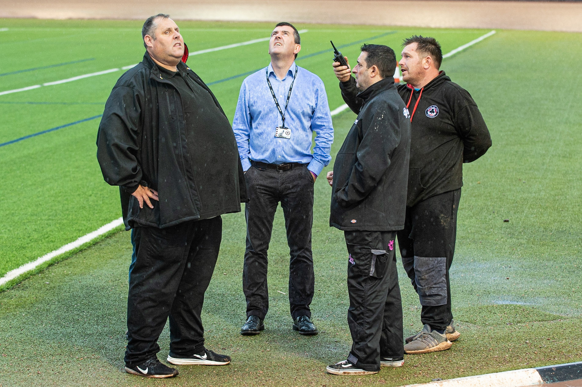 Photo: Ian Charles

Colts manager Steve Williams (1st left), Adrian Smith (2nd left) and Belle Vue Track curator Andy Meredith (1st right) look for a gap in the clouds as the rain continues

Belle Vue Colts v Kent Kings, SGB National League, Belle Vue National Speedway Stadium, Manchester, Thursday 1  August  2019