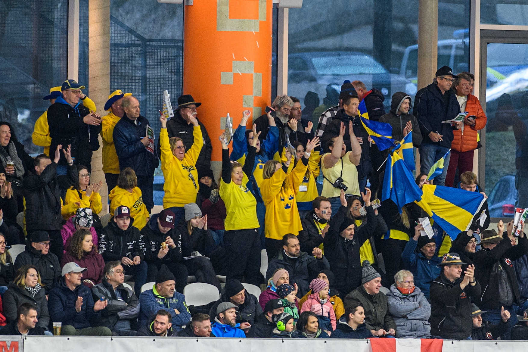 Swedish fans celebrate Stefan Svensson’s win during the FIM Ice Speedway Gladiators World Championship Final 1 at the Max-Aicher-Arena, Inzell on Saturday 23 March 2024. (Photo: Ian Charles | MI News)
