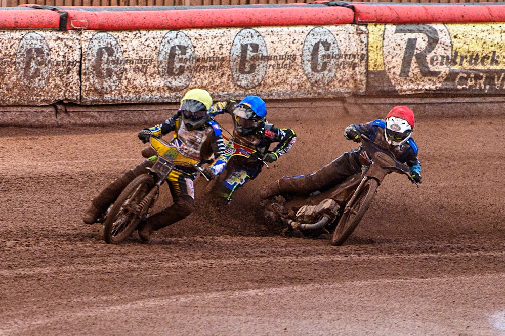 Ben Barker (Yellow) leads as Richard Lawson (Red) and Simon Lambert (Blue) struggle on the heavy track during the Sports Insure British Speedway Final at the National Speedway Stadium, Manchester on Monday 14th August 2023. (Photo: Ian Charles | MI News)