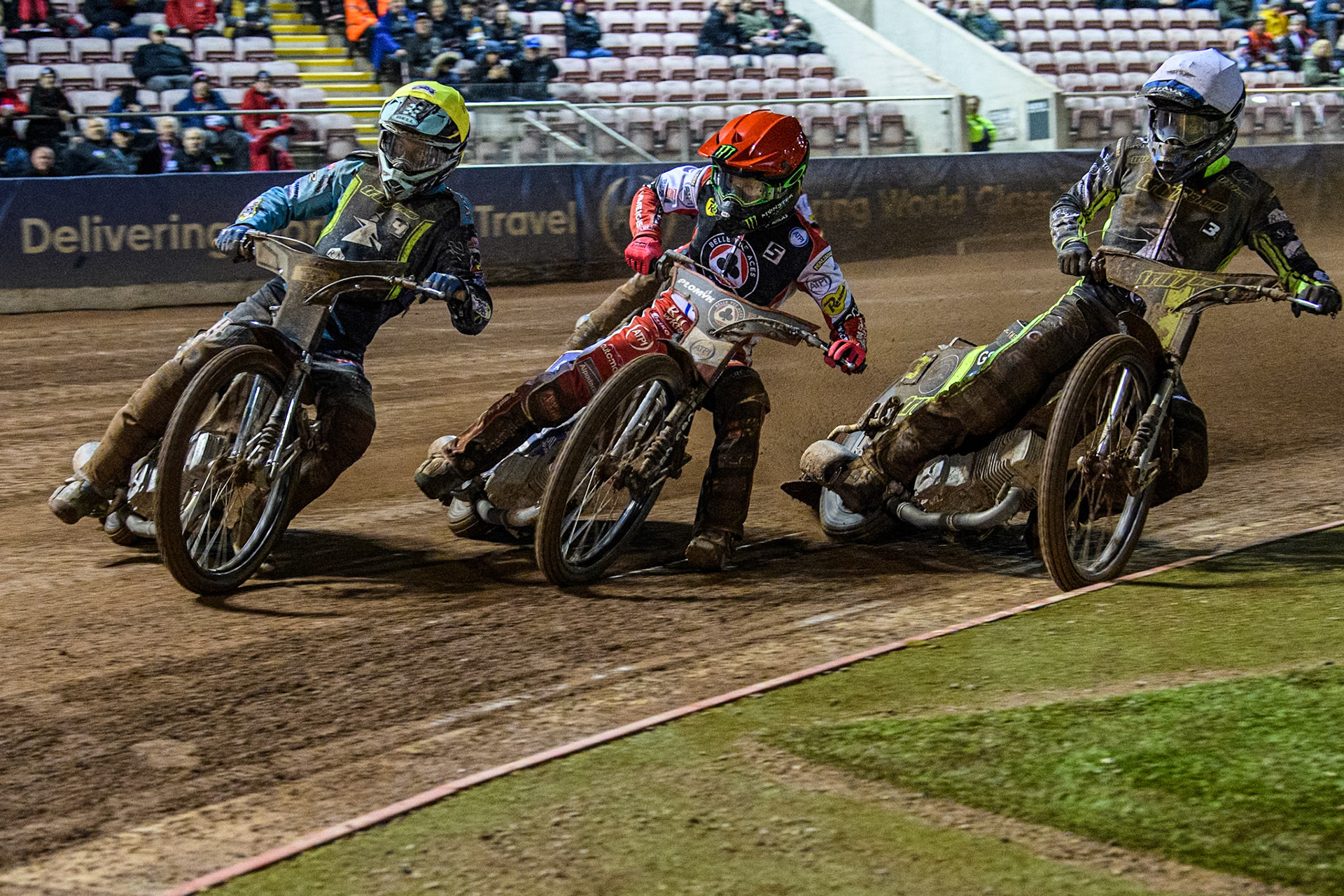 Ipswich Witches' Guest Ryan Douglas in Yellow leading Belle Vue Aces' Dan Bewley in Red and Ipswich Witches' Adam Ellis in White with Belle Vue Aces' Ben Cook in Blue behind during the Rowe Motor Oil Premiership match between Belle Vue Aces and Ipswich Witches at the National Speedway Stadium, Manchester on Monday 22nd April 2024. (Photo: Ian Charles | MI News)