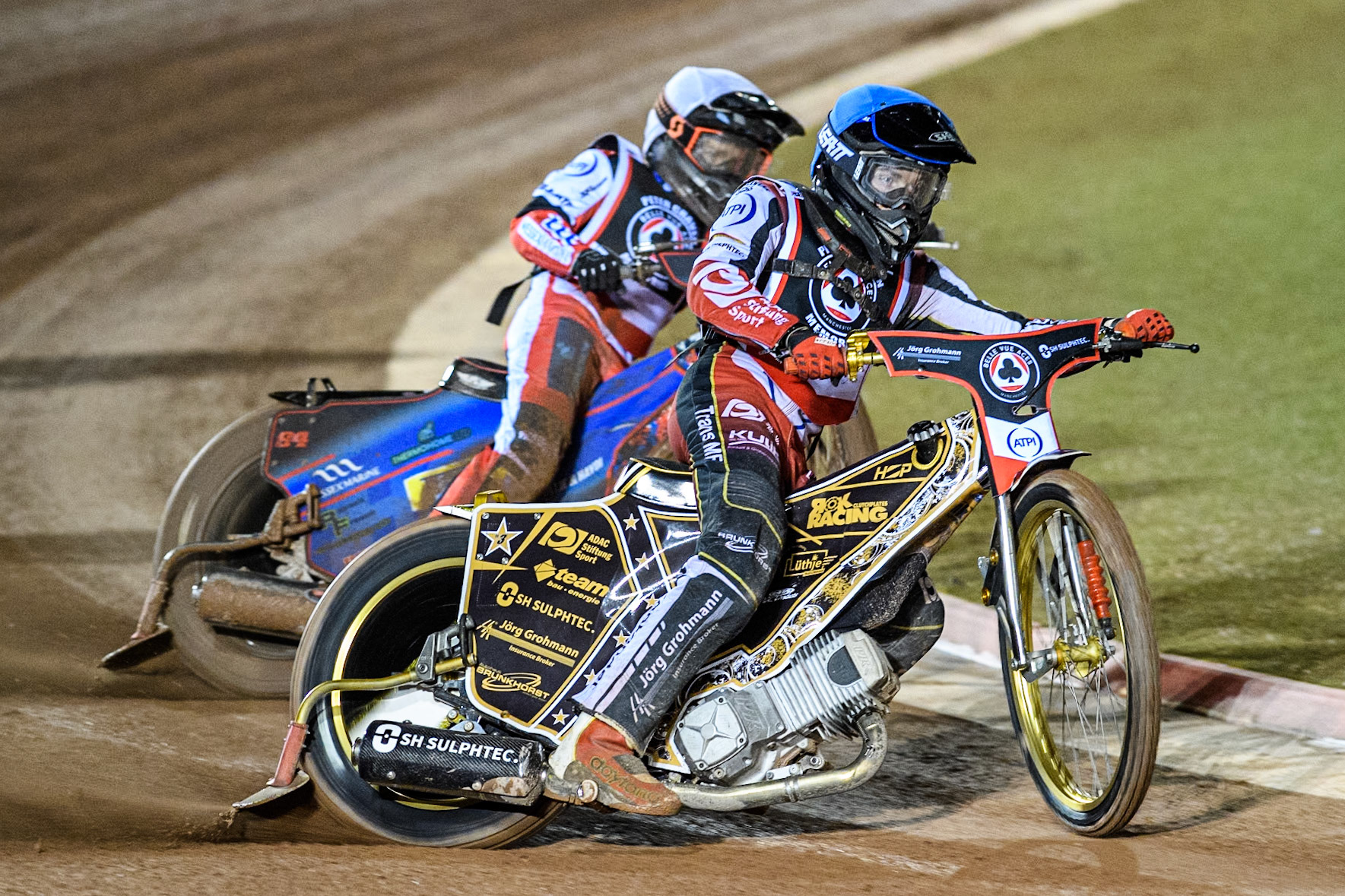 Germany's Norick Blödorn (Blue) leads  Australia's Ben Cook (White) during the Peter Craven Memorial Trophy meeting at the National Speedway Stadium, Manchester on Monday 18th March 2024. (Photo: Ian Charles | MI News)