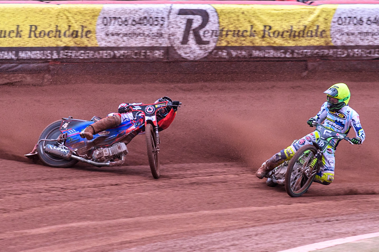 Belle Vue Aces' Ben Cook in Blue loses control after a tangle with Oxford Spires' Charles Wright in Yellow during the Rowe Motor Oil Premiership match between Belle Vue Aces and Oxford Spires at the National Speedway Stadium, Manchester on Monday 22nd July 2024. (Photo: Ian Charles | MI News)