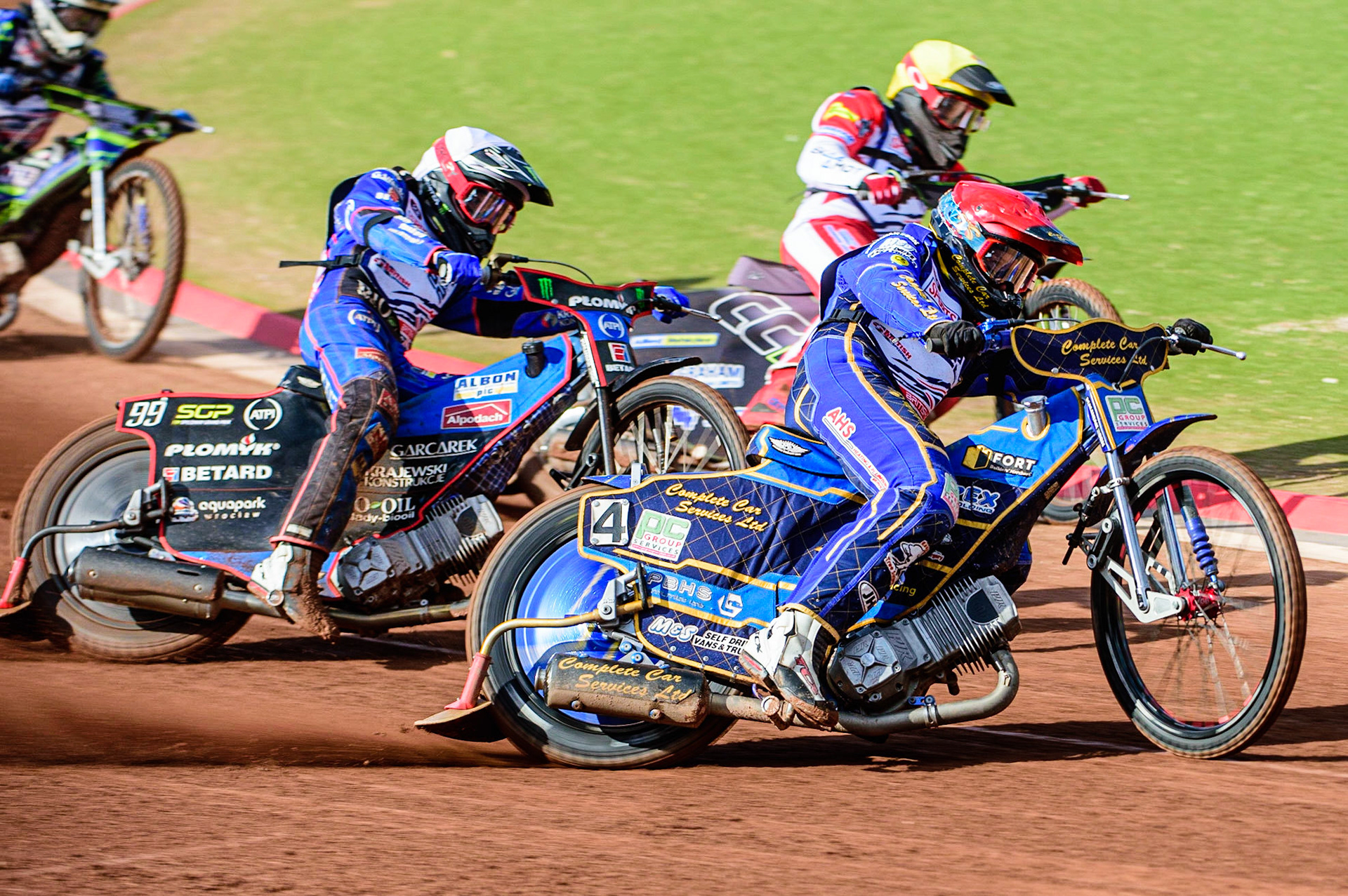 Kyle Howarth  (Red) outside Craig Cook  (Yellow) and Dan Bewley  (White) during the Sports Insure British Speedway Final, at the National Speedway Stadium, Manchester, on Sunday 18th September 2022. (Credit: Ian Charles | MI News )