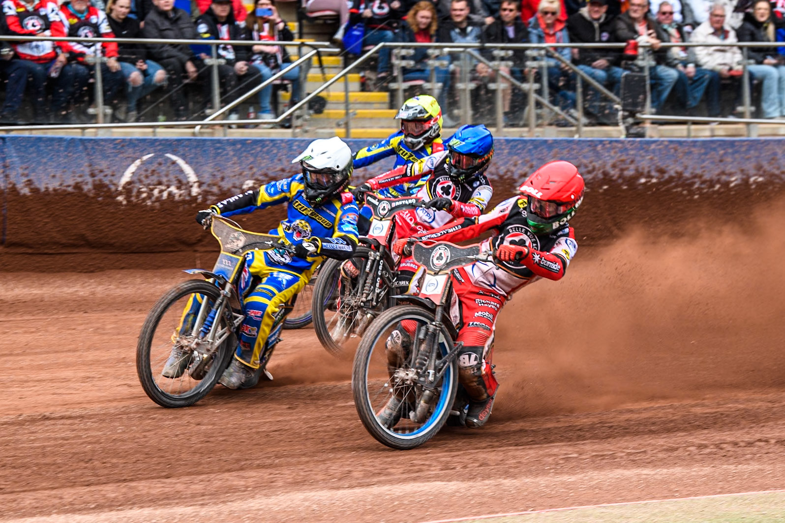 Brady Kurtz of Belle Vue Aces  in Red rides inside Jack Holder of Sheffield Tigers in White, with Dan Bewley of Belle Vue Aces in Blue and Josh Pickering of Sheffield Tigers in White behind during the Rowe Motor Oil Premiership match between Belle Vue Aces and Sheffield Tigers at the National Speedway Stadium, Manchester on Monday 5th May 2025. (Photo: Ian Charles | MI News)