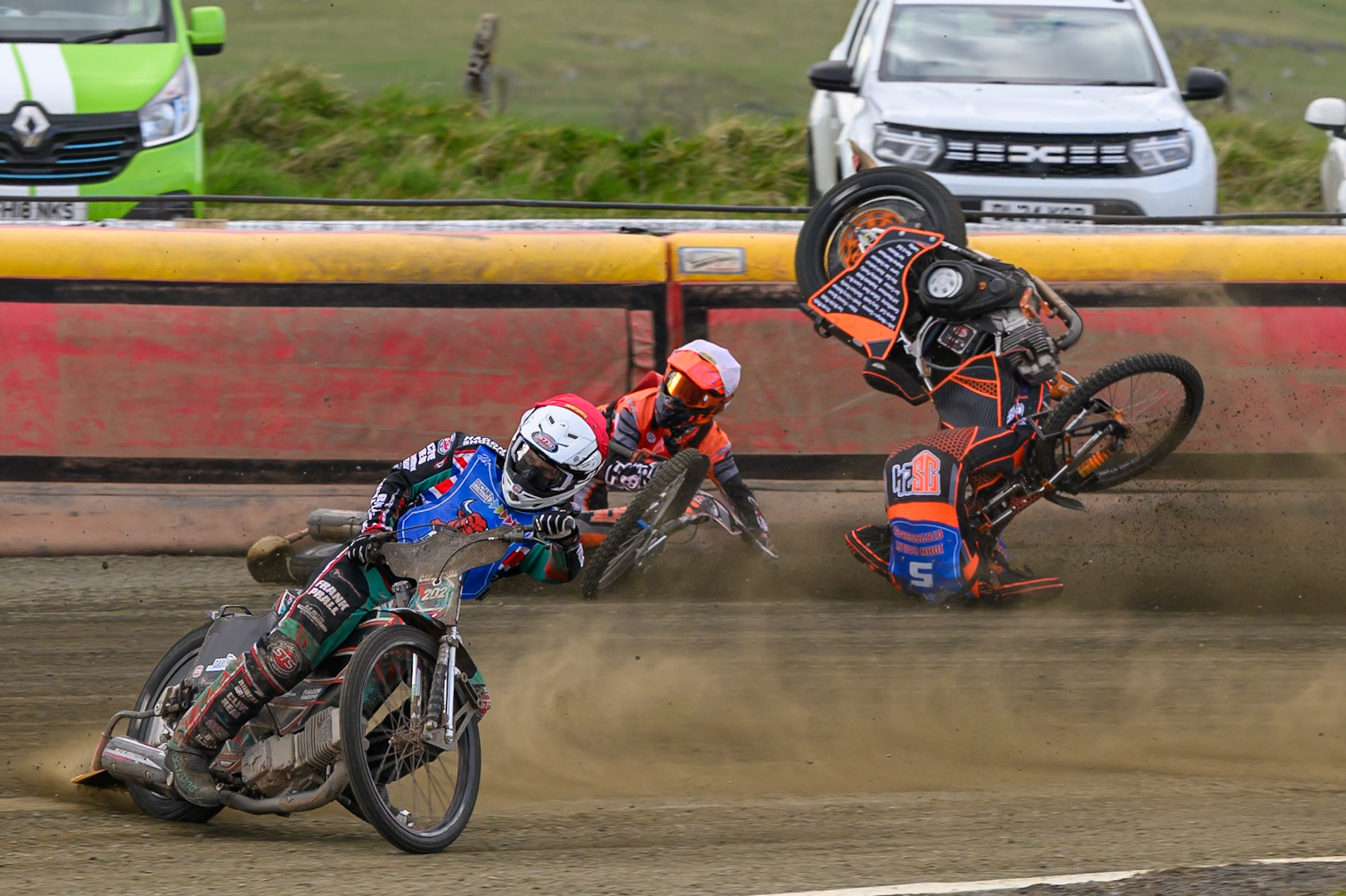 Connor Coles of NDL Nomads   in White fall and Jack Smith of Buxton Bulls   in Blue collides with him during the  Challenge match between Buxton Bulls and NDL Nomads at Hi-Edge Speedway, Buxton on Sunday 19th April 2026. (Photo: Ian Charles | MI News)